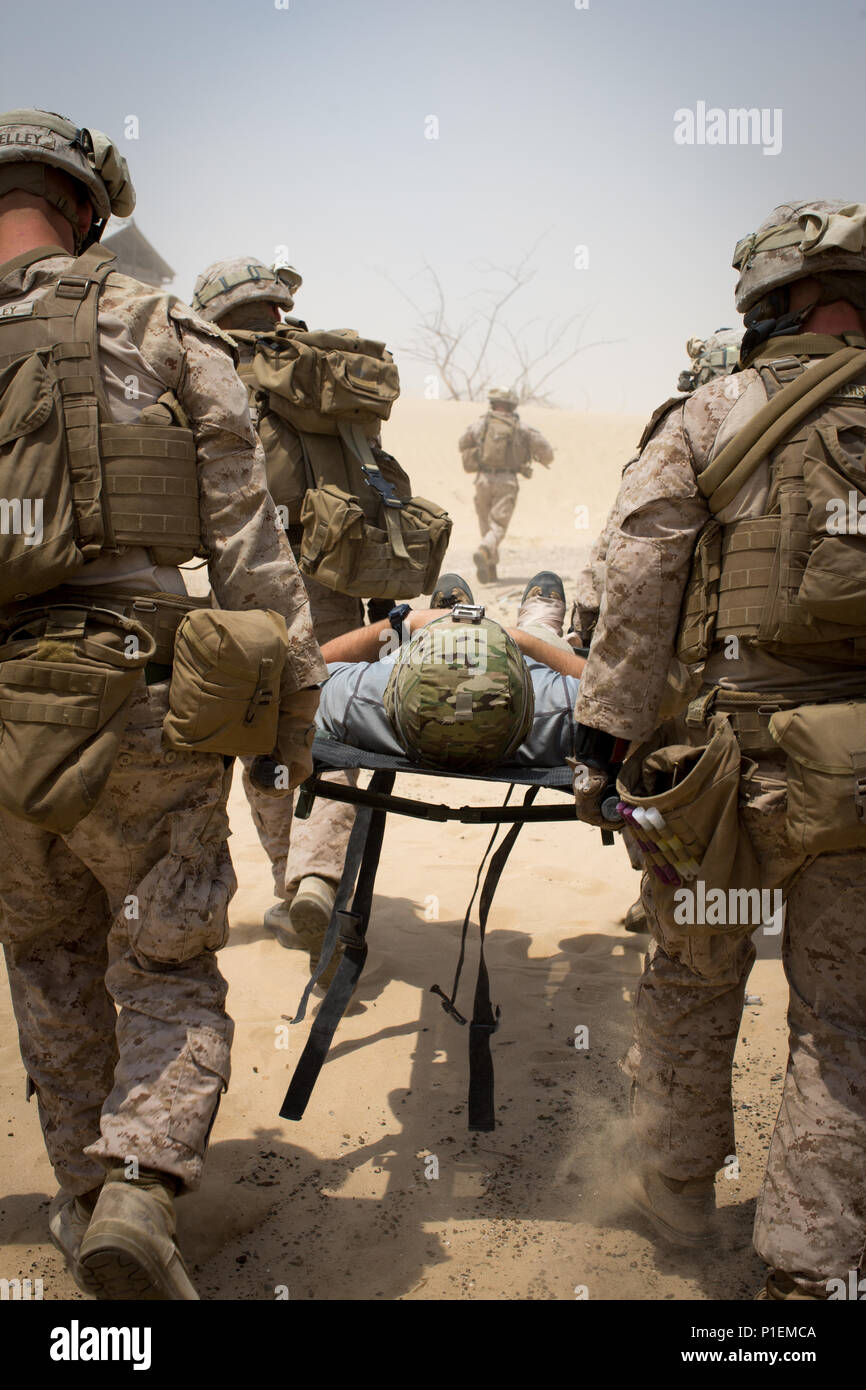 A simulated casualty is carried during a Special Purpose Marine Air Ground Task Force - Crisis Response - Central Command tactical recovery of aircraft and personnel exercise, Aug. 02, 2016. SPMAGTF – CR – CC is a self-sustaining expeditionary unit, designed to provide a broad range of crisis response capabilities throughout the Central Command area of responsibility, using organic aviation, logistical, and ground combat assets, to include TRAP and embassy reinforcement. (U.S. Marine Corps photo by Cpl. Trever Statz/Released) Stock Photo