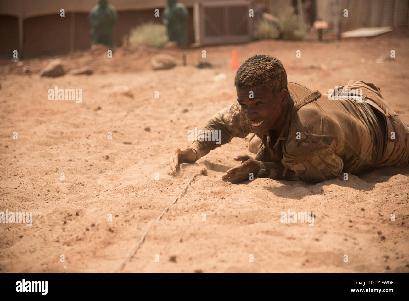 U.S. Army Spc. Carey Clarke, 1st Battalion, 124th Infantry Regiment hides a wire after securing a mock claymore mine during a spur ride event in support of Combined Joint Task Force- Horn of Africa at a nearby airfield in Djibouti, Oct. 21, 2016. Twenty-eight U.S. Army Soldiers and one Air Force Airman participated in the traditional Army event where they completed 10 tasks with various stress events before each task in approximately 19 hours. Combined Joint Task Force-Horn of Africa is a multinational effort to conduct theater security cooperation, combat violent extremism and enable freedom  Stock Photo