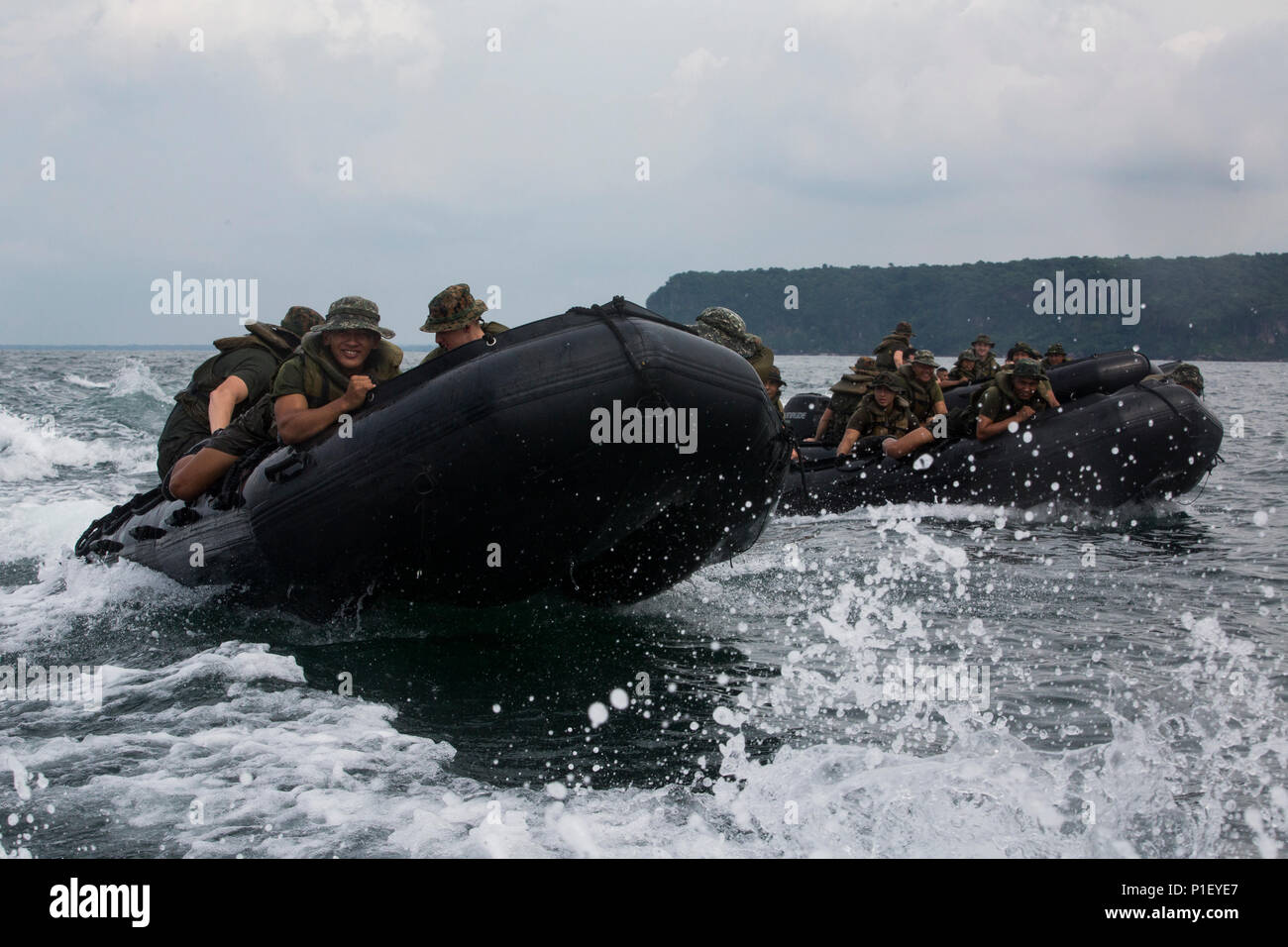 Philippine Marines join U.S. Marines with Fox Company, Battalion Landing Team, 2nd Battalion, 4th Marine Regiment, 31st Marine Expeditionary Unit, during combat rubber raiding craft training as part of Philippine Amphibious Landing Exercise 33 (PHIBLEX) off the coast of Marine Barracks Gregorio Lim, Ternate, Philippines, Oct. 5, 2016. PHIBLEX is a bilateral training exercise designed to improve the interoperability, readiness and professional relationships between the U.S. Marine Corps and partner nations. (U.S. Marine Corps photo by Cpl. Darien J. Bjorndal) Stock Photo