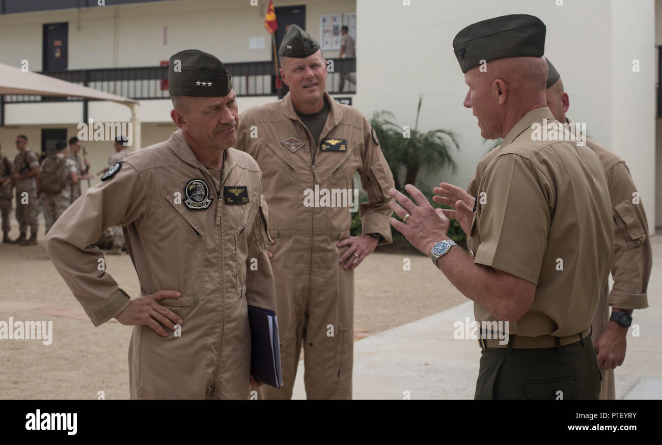 From left to right, U.S. Marine Corps Lt. Gen. Jon Davis, deputy commandant for aviation, Maj. Gen. Mark Wise, 3rd Marine Aircraft Wing (MAW) commanding general, are greeted by Col. Richard Fuerst, commanding officer of Marine Corps Air Station (MCAS) Iwakuni, Japan, at MCAS Yuma, Ariz. Oct. 24, 2016. This event gave Yoshihiko Fukuda, mayor of Iwakuni City, Japan, an idea of what to expect of the aircraft following the scheduled basing of Marine Fighter Attack Squadron (VMFA) 121 at MCAS Iwakuni. After its transition, VMFA-121 will be the first F-35B squadron stationed in Japan.(U.S. Marine Co Stock Photo