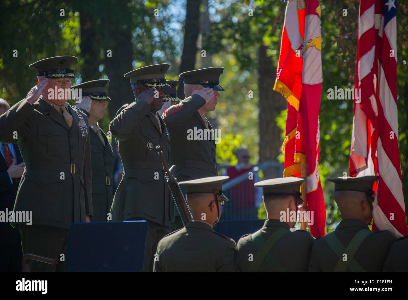U.S. Marine Corps Maj. Gen. Walter L. Miller Jr., commanding general, left, II Marine Expeditionary Force, salutes the colors as they are retired during the 33rd Beirut Memorial Observance Ceremony, Lejeune Memorial Gardens, Jacksonville, N.C., Oct. 23, 2016. A memorial observance is held October 23rd of each year to remember those lives lost during the terrorist attack at U.S. Marine Barracks, Beirut, Lebanon, in 1983. (U.S. Marine Corps photo by Lance Cpl. Austin M. Livingston) Stock Photo