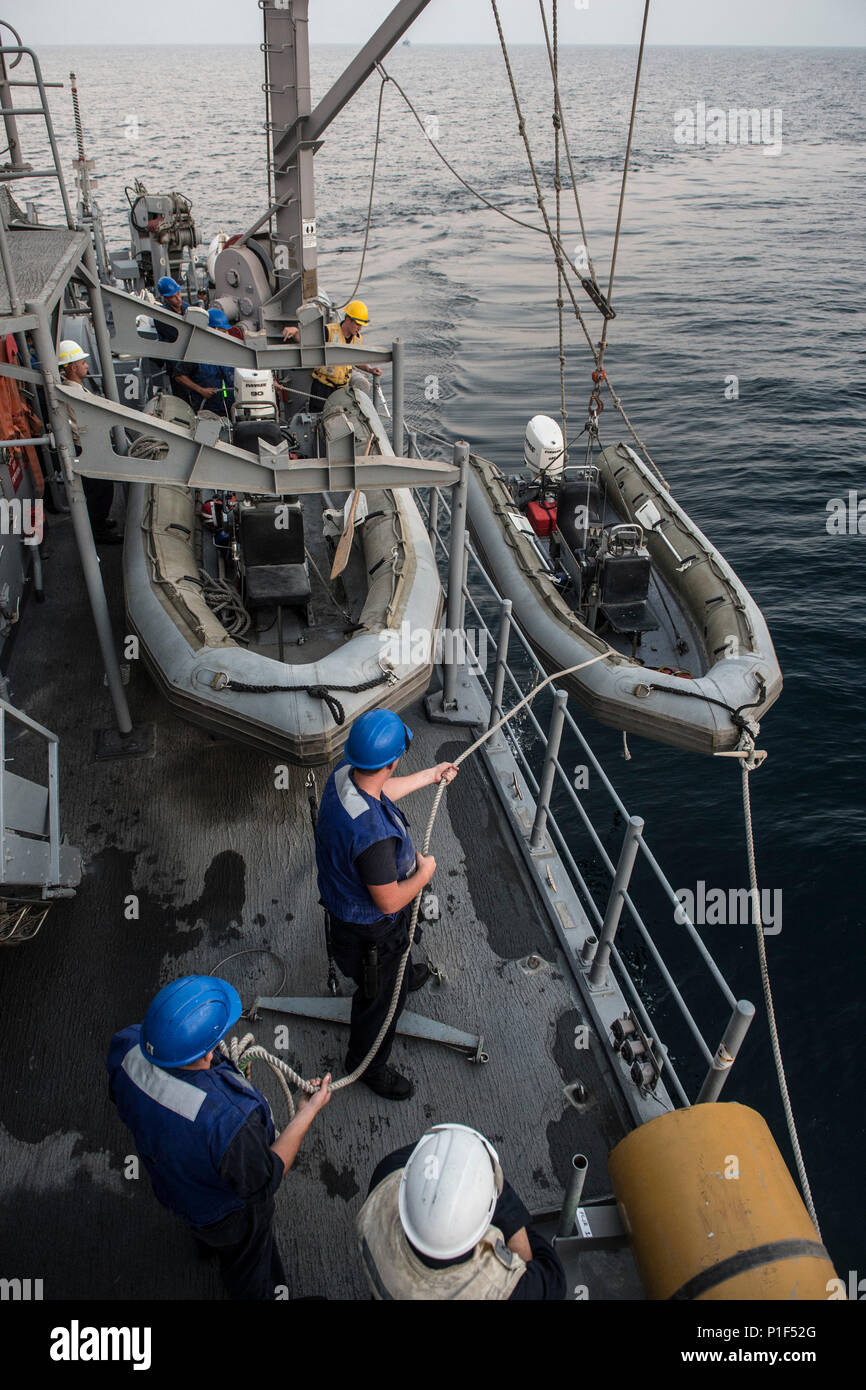 161019NSB5870983 Sailors lower a 5meter rigidhull inflatable boat