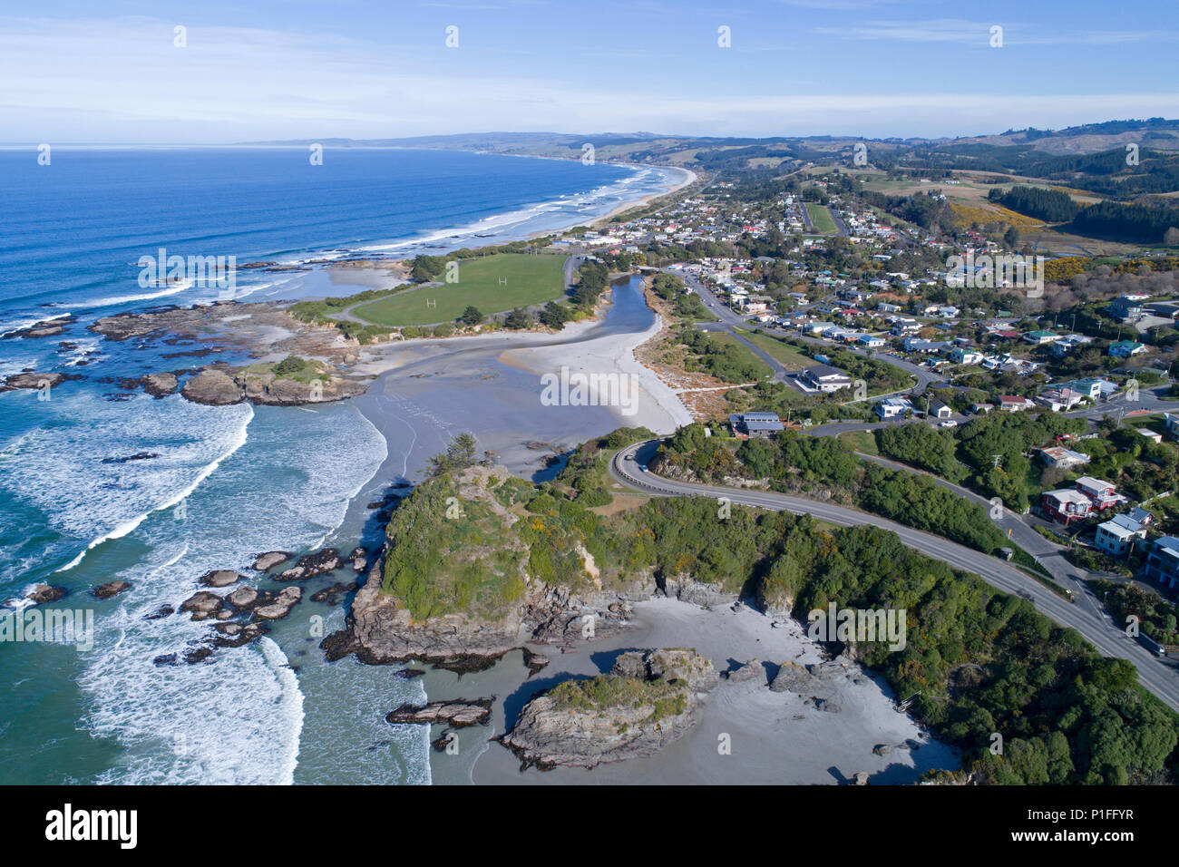 Brighton Beach and Big Rock Corner, Brighton, Dunedin, South Island, New Zealand - drone aerial Stock Photo