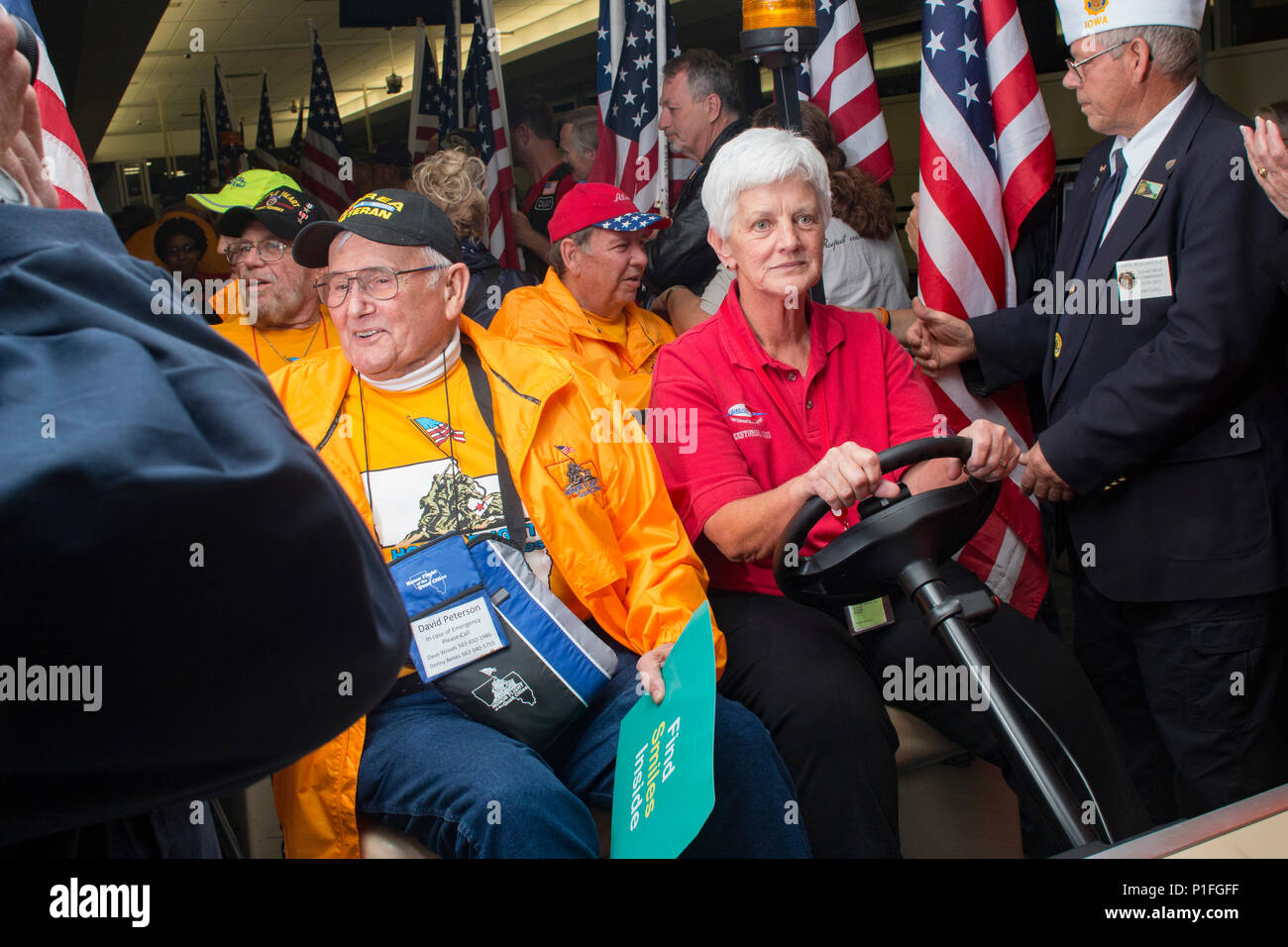 Veterans deboard their honor flight at the Quad City International Airport, Ill., Oct. 27, 2016. Honor Flight of the Quad Cities, a chapter of the Honor Flight Network, organizes flights for veterans of World War II and the Korean and Vietnam Wars to visit memorials dedicated to them in Washington, D.C. Volunteers, known as “guardians,” accompany the veterans to keep them company and assist as needed. Approximately 95 veterans and 65 guardians participated in this flight. (Photo by Staff Sgt. Ian M. Kummer, First Army Public Affairs) Stock Photo