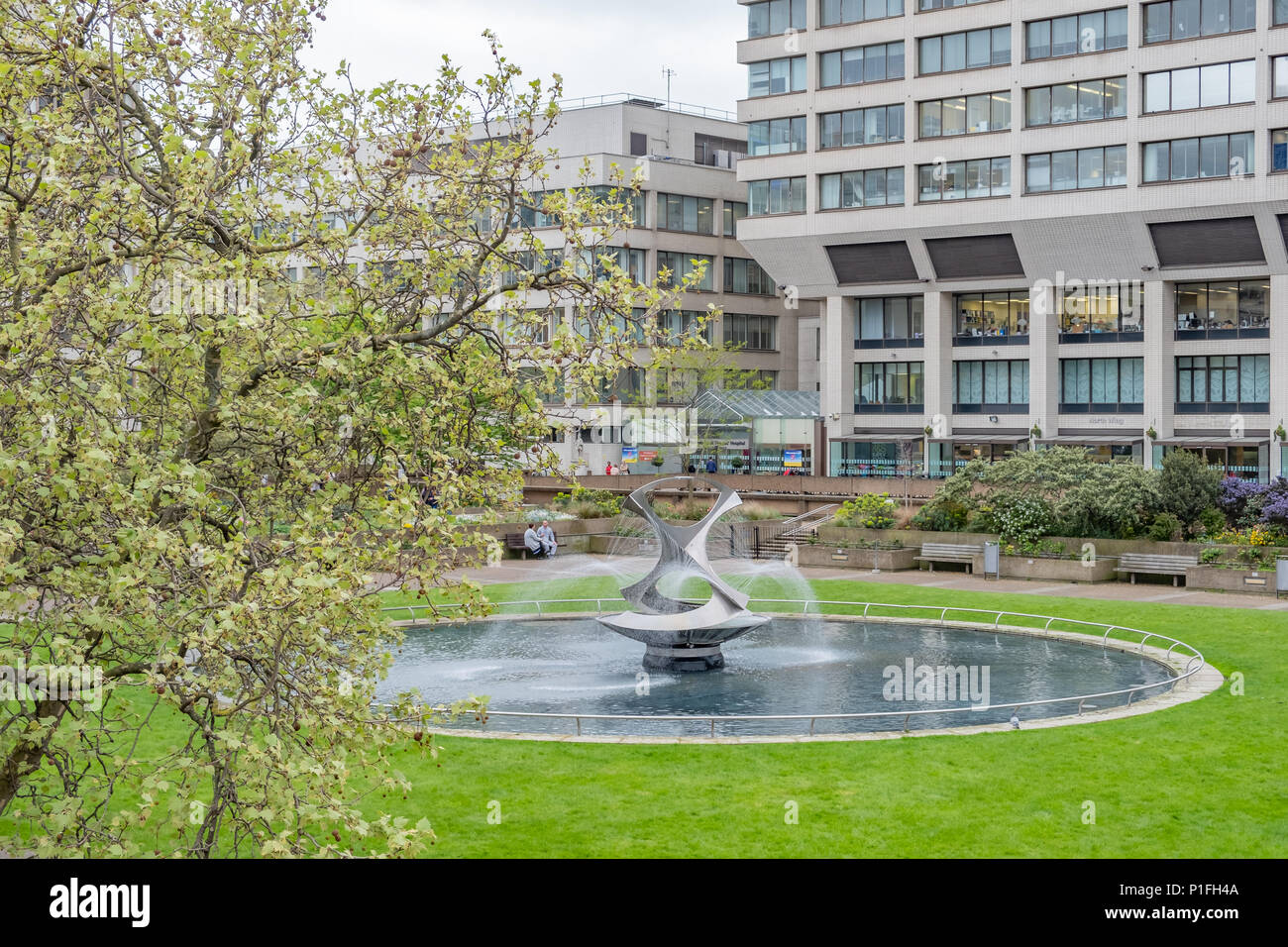 Revolving Torsion is a kinetic sculpture and fountain by artist Naum Gabo and is located on the grounds of St. Thomas Hospital in London. Stock Photo