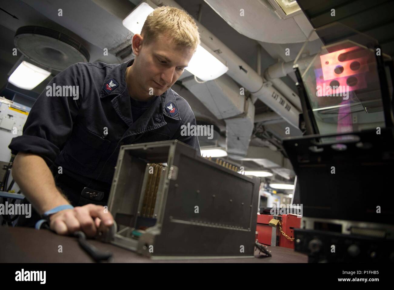 Aviation electronics technician aboard aircraft carrier USS Dwight D ...