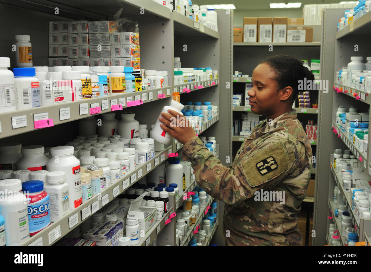 Sgt. Jessica Evans, pharmacy specialist with the 31st Combat Support Hospital and Clewiston, Fla. native, restocks pharmacuticals Oct. 25, 2016 at Camp Arifjan, Kuwait. Evans along with a small team of Soldiers operate the 31st CSH pharmacy providing pharmaceutical support to patients suffering from injuries and illnesses throughout the ARCENT area of operations. The team processes more than 3,500 outpatient prescriptions a month to service members and civilians while providing support to inpatient care and other facilities throughout the region. (U.S. Army photo by Sgt. Aaron Ellerman) Stock Photo
