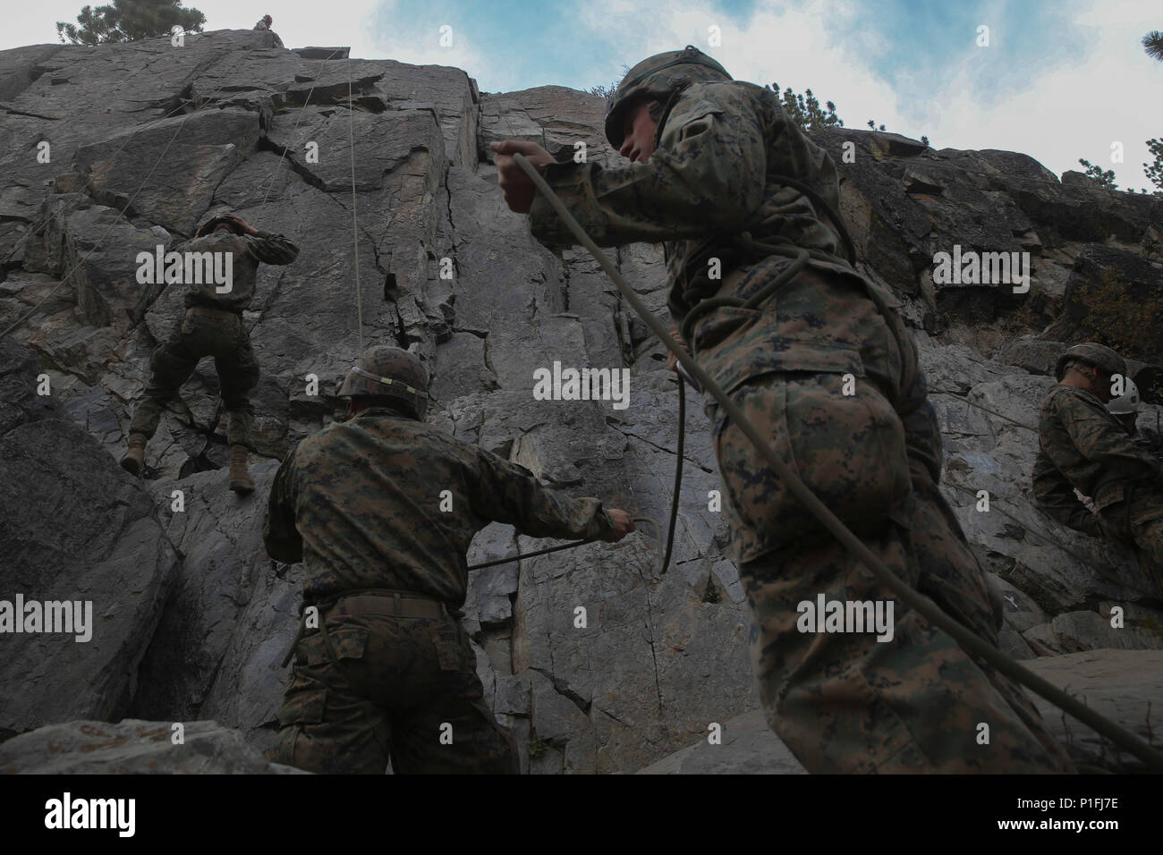 Marines with Company L, 3rd Battalion, 4th Marine Regiment, conduct top ...