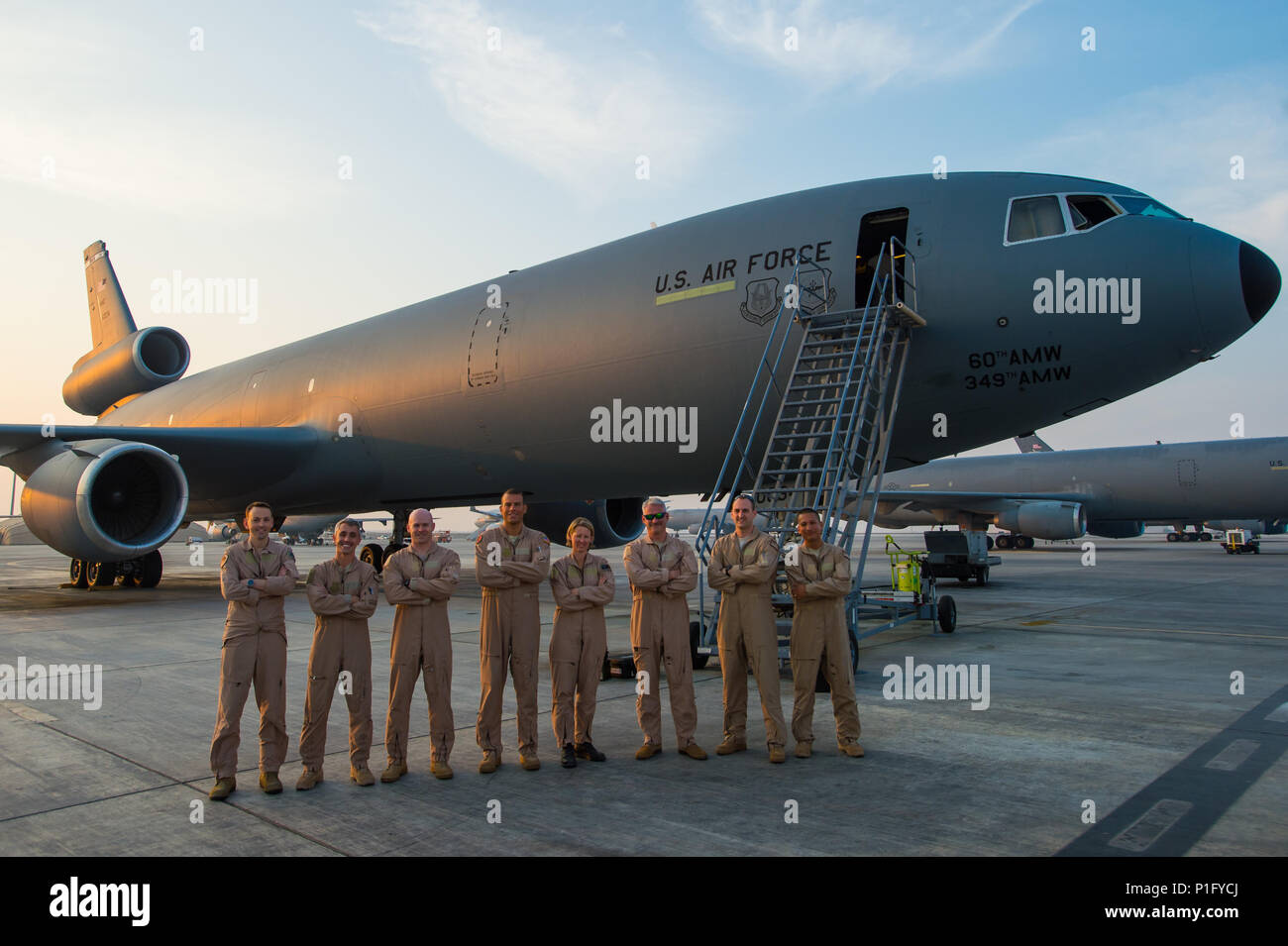 A U.S. Air Force KC-10 Extender crew and a Royal Australian Air Force KC-30A crew pose for a photo after completing the first ever coalition formation departure at an undisclosed location in Southwest Asia, Oct. 25, 2016. Between the two air craft, they had the capability to collectively travel more than 20,000 miles in a joint effort to refuel allied air craft in support of the liberation of Mosul, Iraq. (U.S. Air Force photo by Senior Airman Tyler Woodward) Stock Photo