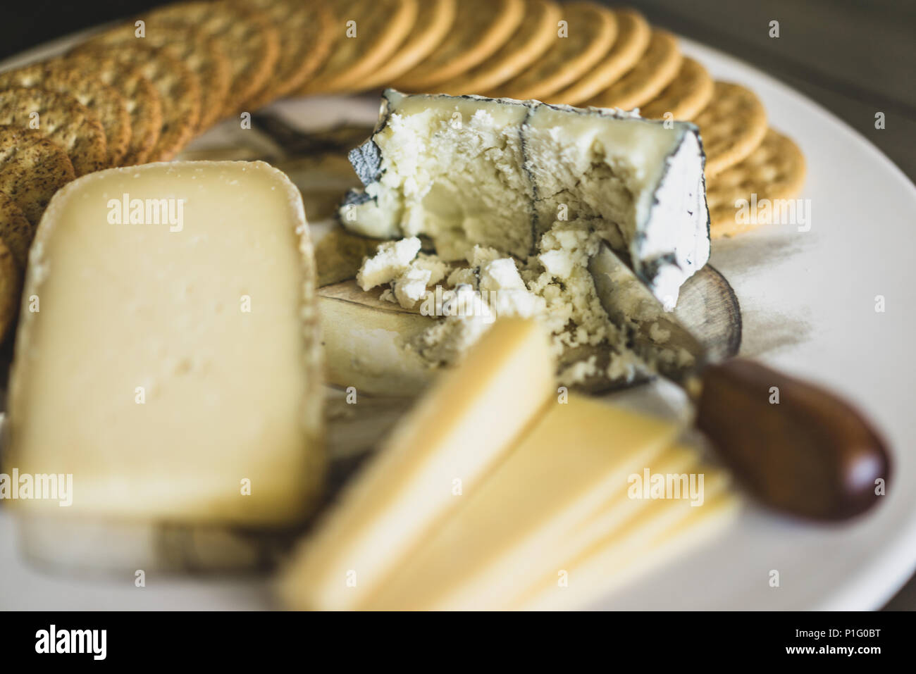 cheese board with various cheeses Stock Photo
