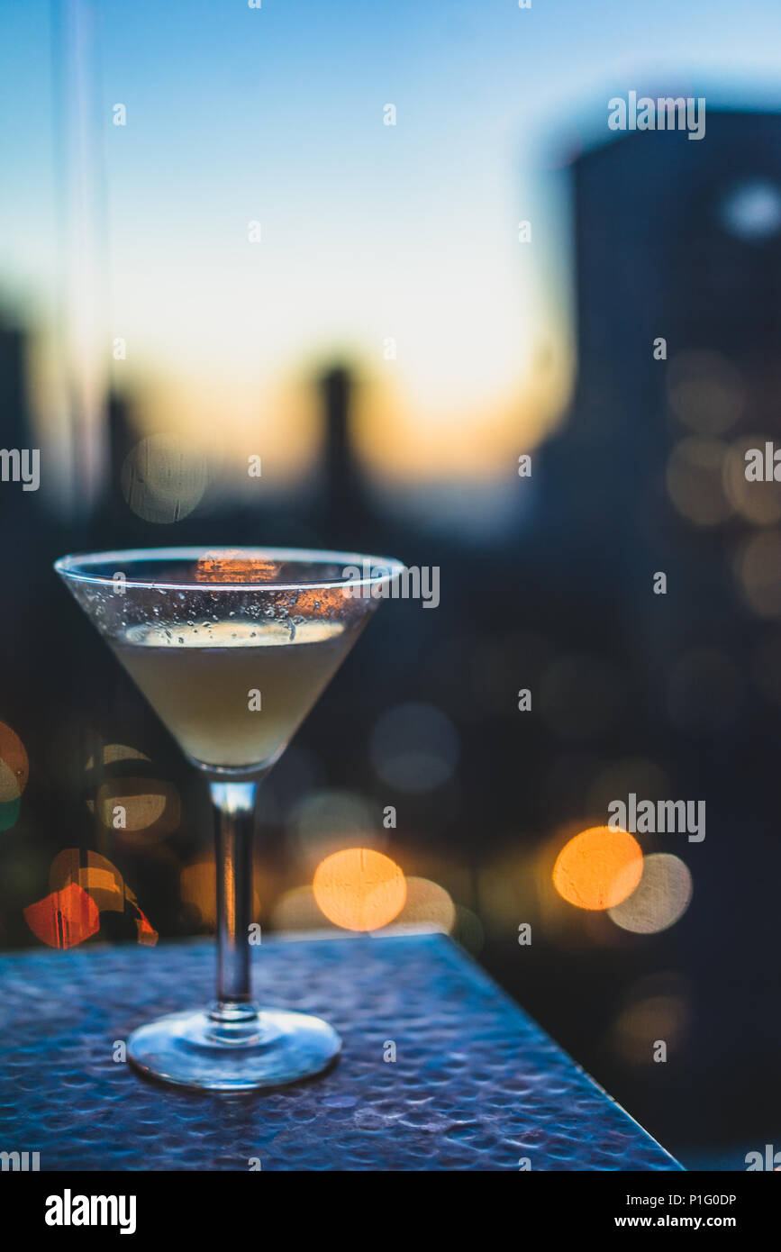 Closeup of cocktail overlooking city Stock Photo