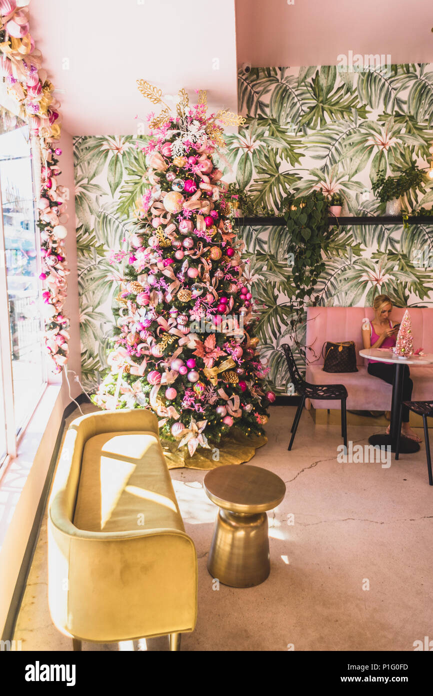 pink and gold christmas tree in a cafe Stock Photo