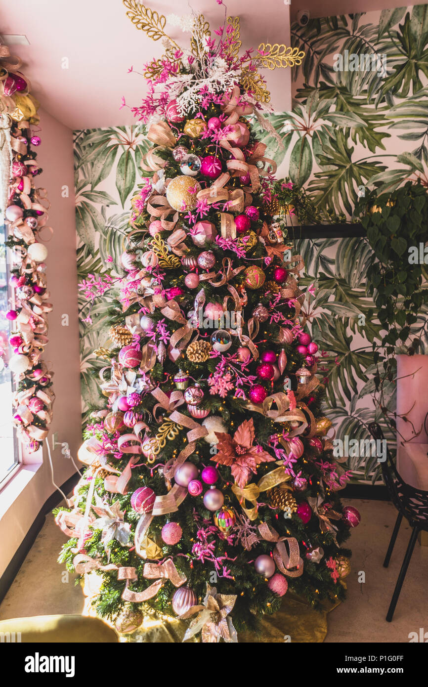 christmas tree with pink and gold ornaments Stock Photo - Alamy