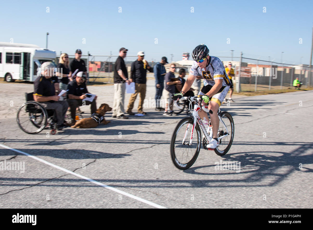 U.S. Army Lt. Col. Walter Castro, Fort Benning, finishes lap 2 of a 30k time trial during the Regional Health Command - Atlantic 2016 Warrior Games Regional Trials, at Lawson Army Airfield, on Fort Benning, Ga., October 31, 2016. The Regional Health Command - Atlantic is one of four Army regional health command's hosting regional trials across the country. Regional competitors who excel in the qualifying events will advance to the Army Warrior Games at Fort Bliss, Texas in February 2017.  (U.S. Army Photo by Staff Sgt. Brian Kohl) Stock Photo