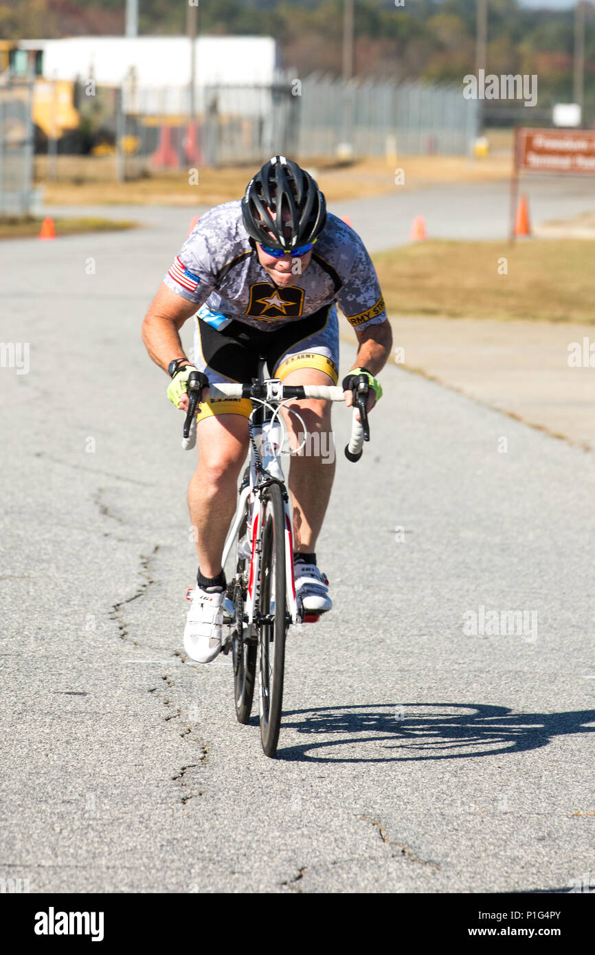 U.S. Army Lt. Col. Walter Castro, Fort Benning, pushes to the finish line of a cycling 30k time trial event during the Regional Health Command - Atlantic 2016 Warrior Games Regional Trials, at Lawson Army Airfield, on Fort Benning, Ga., October 31, 2016. The Regional Health Command - Atlantic is one of four Army regional health command's hosting regional trials across the country. Regional competitors who excel in the qualifying events will advance to the Army Warrior Games at Fort Bliss, Texas in February 2017. (U.S. Army Photo by Staff Sgt. Brian Kohl) Stock Photo