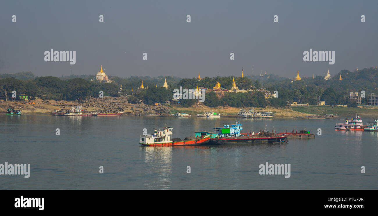 Cargo boats on the Irrawaddy River in Mandalay, Myanmar. Irrawaddy is the country largest river