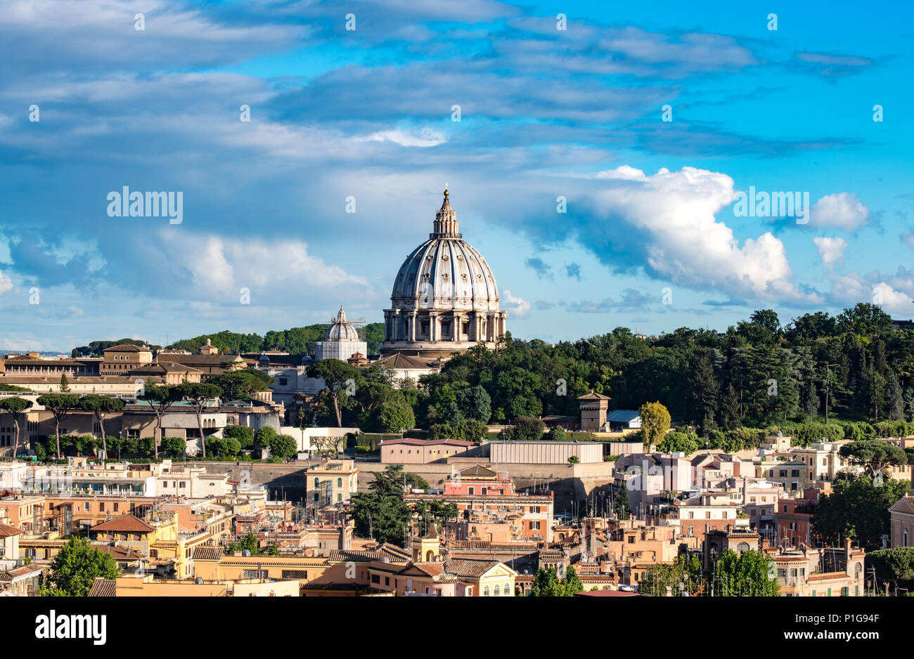 Panoramic view of St Peter cathedral dome on scenic Rome cityscape with blue sky Stock Photo