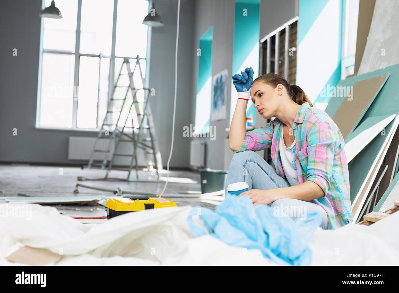Dog-tired young woman having a break Stock Photo