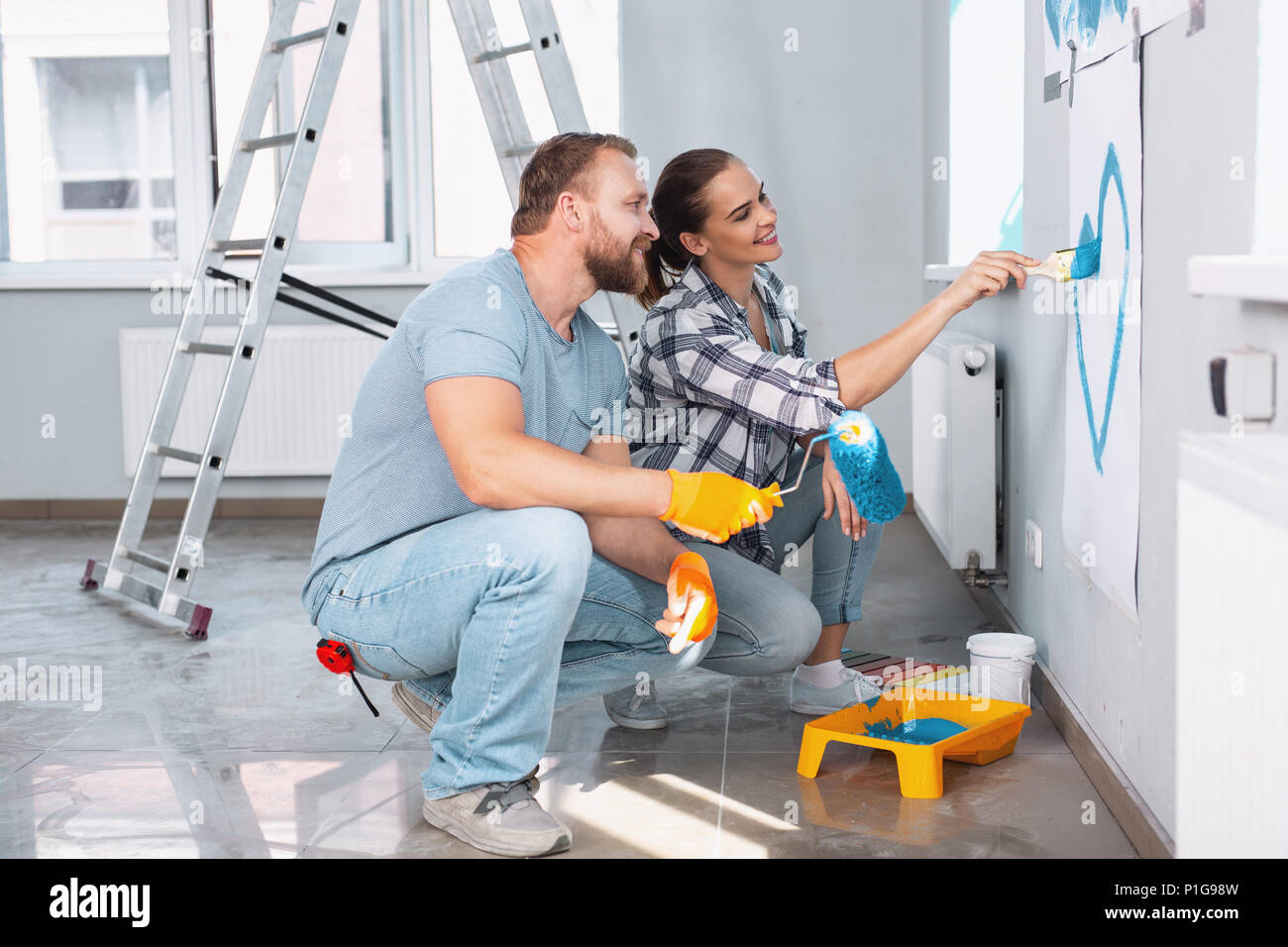 Loving couple doing renovations together Stock Photo
