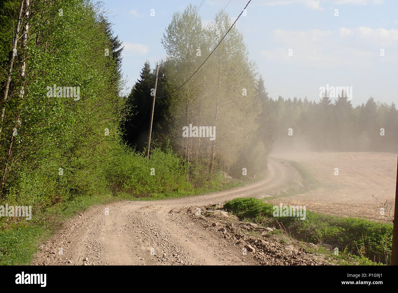 Dusty colors of spring road. Erkylä, Hausjärvi, Finland. 15.5.2018. Stock Photo