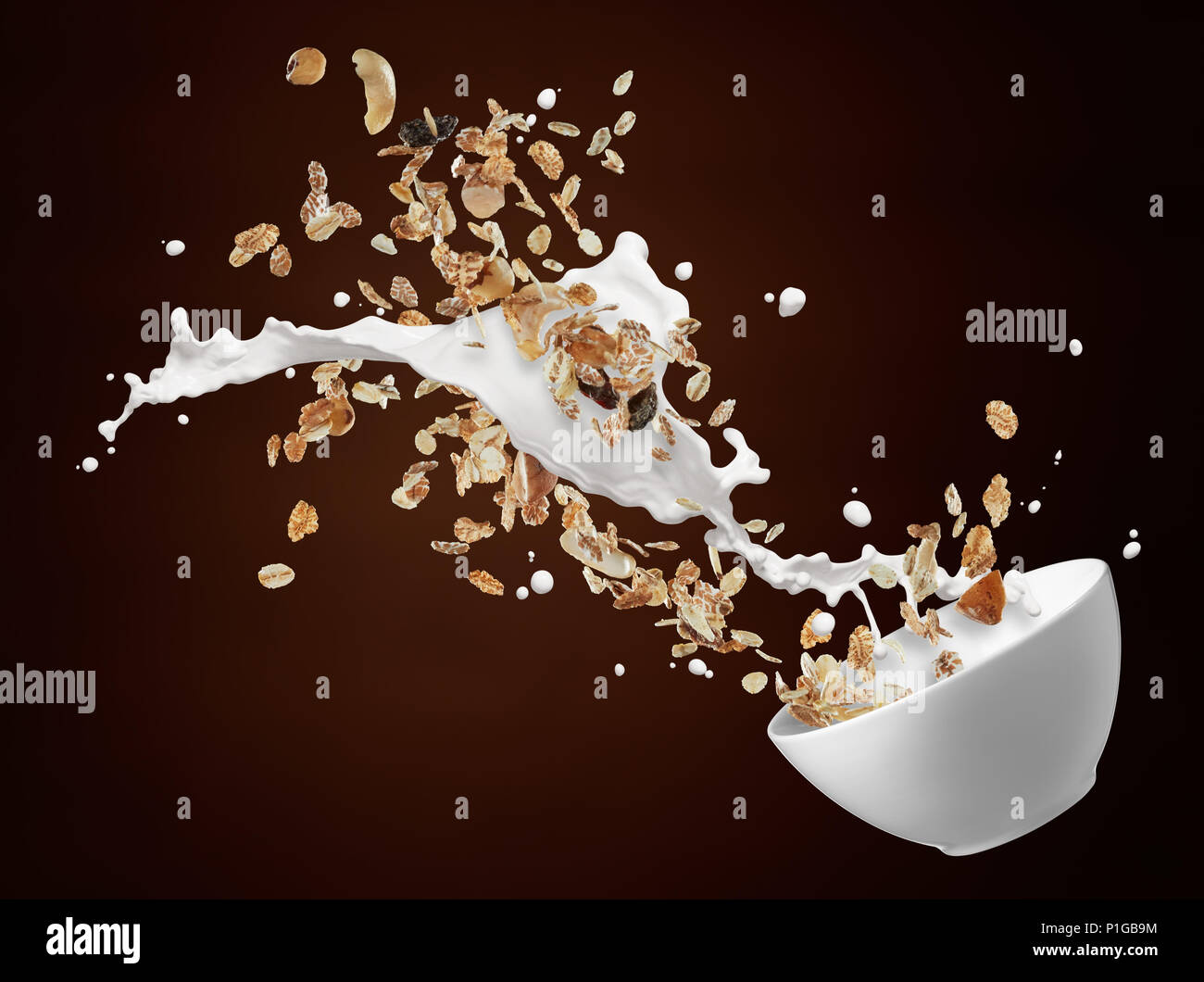 bowl of muesli with milk splash against brown background Stock Photo