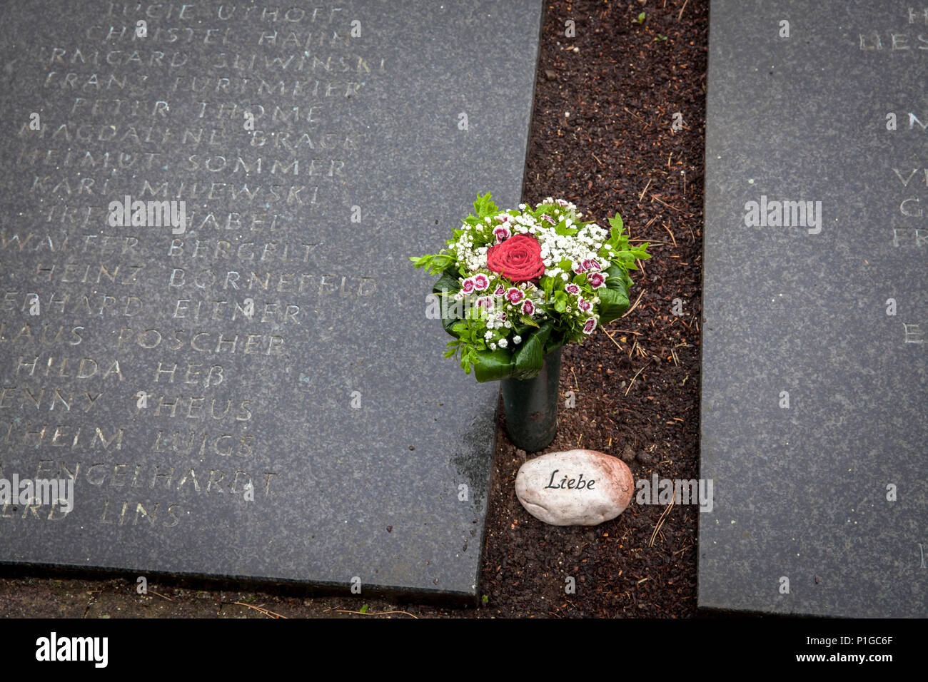 Germany, name plates for the deceased who were buried in lawn graves at the Suedfriedhof in Duesseldorf.  Deutschland, Namensplatten fuer Verstorbene, Stock Photo