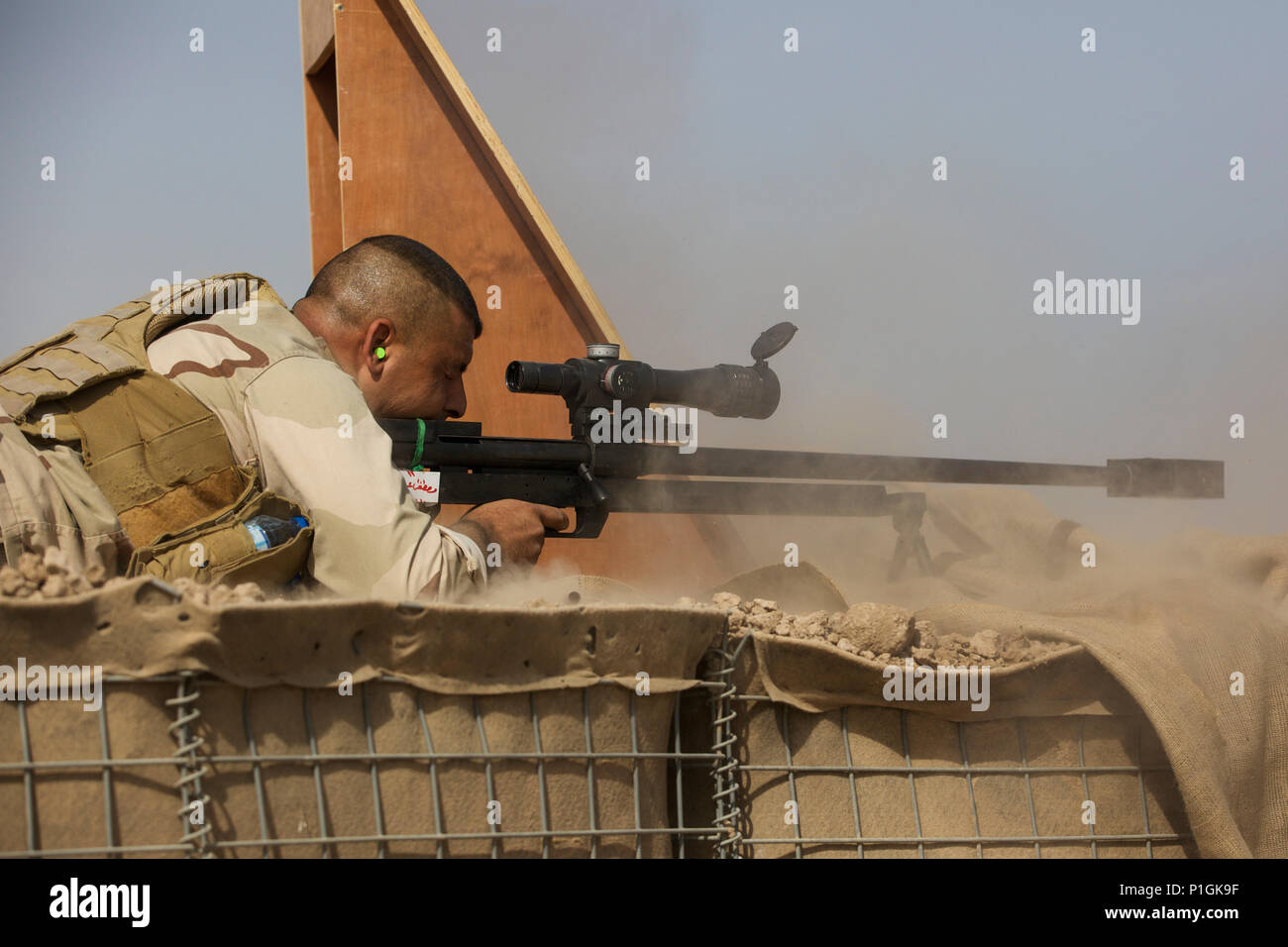 An Iraqi Ranger Thunder Battalion soldier fires his sniper rifle during ...