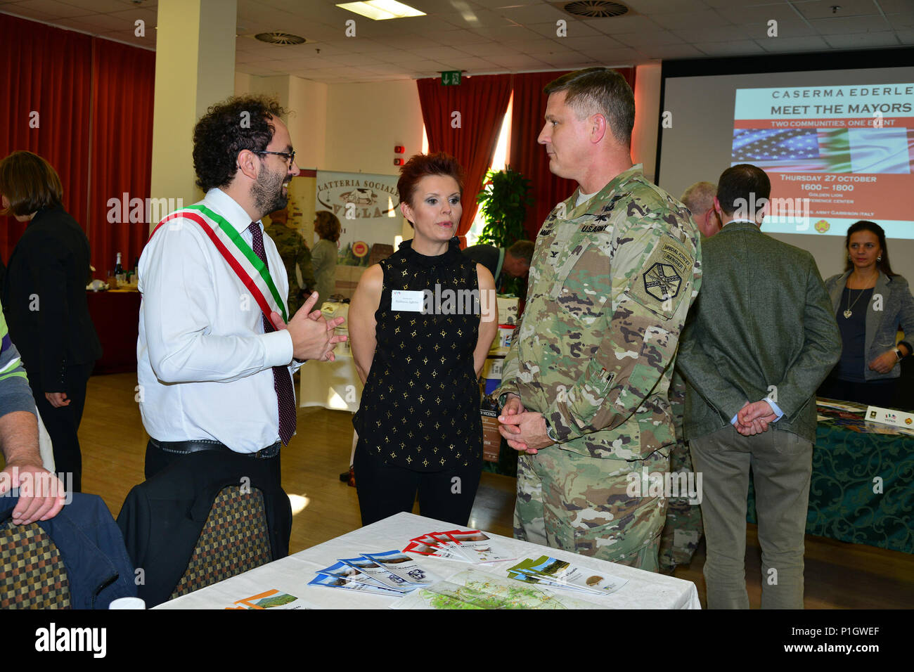 U.S. Army Col. Steve Marks, U.S. Army Garrison Italy commander, speaks with  Mauro Furlanello, Lozzo Atestino assessor, during the eighth annual Meet  the Mayors event at the Golden Lion Conference Center on, image size:1300x956
