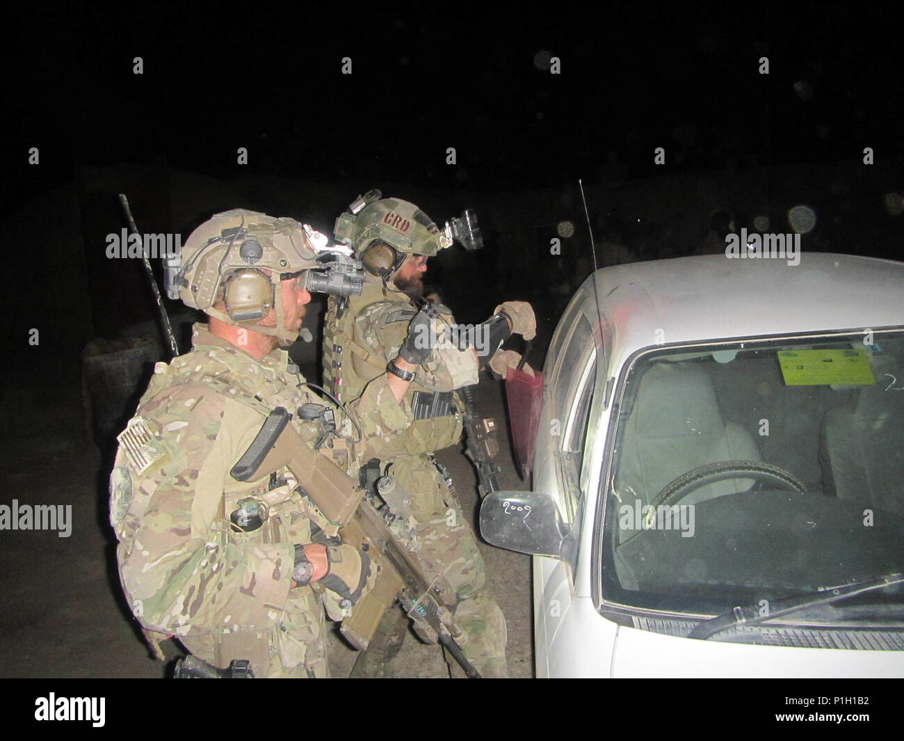 U.S. Special Forces Soldiers, attached to Special Operations Task Force-Afghanistan, conduct Sensitive Site Exploitation (SSE) inside a compound of interest during an operation in the Bakwah district, Farah province, Afghanistan, Oct. 17, 2016. The Operation was conducted, alongside Afghan police officers from the National Interdiction Unit (NIU), in order to disrupt the flow and production of narcotics and drug labs belonging to the Taliban in the area. (U.S. Army photo by Sgt. Connor Mendez/Reviewed) Stock Photo
