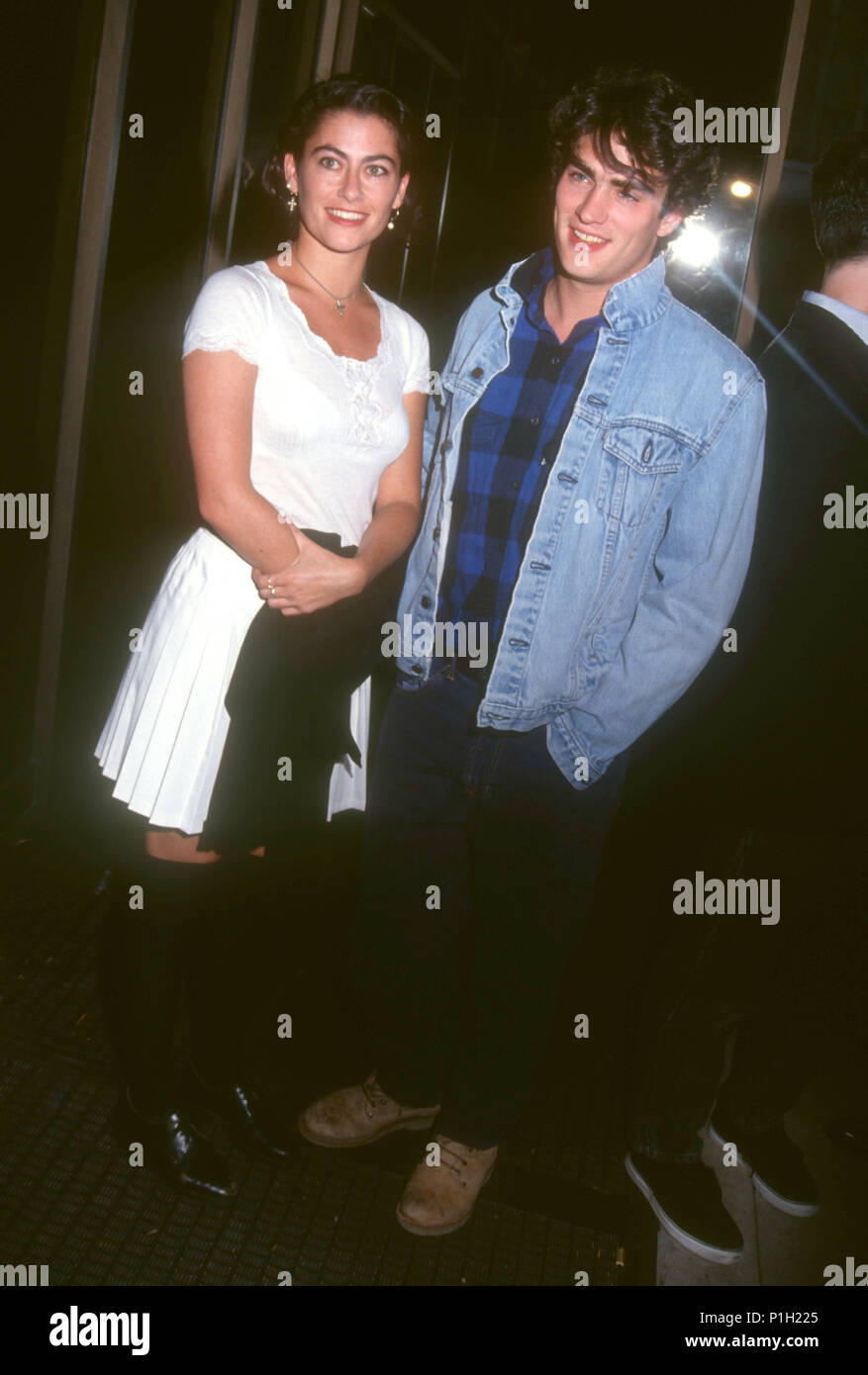 BEVERLY HILLS, CA - OCTOBER 11: (L-R) Actress Roxana Zal and actor Rodney Harvey attend the 'My Own Private Idaho' Beverly Hills Premiere on October 11, 1991 at the Academy of Motion Picture Arts & Sciences Theatre in Beverly Hills, California. Photo by Barry King/Alamy Stock Photo Stock Photo