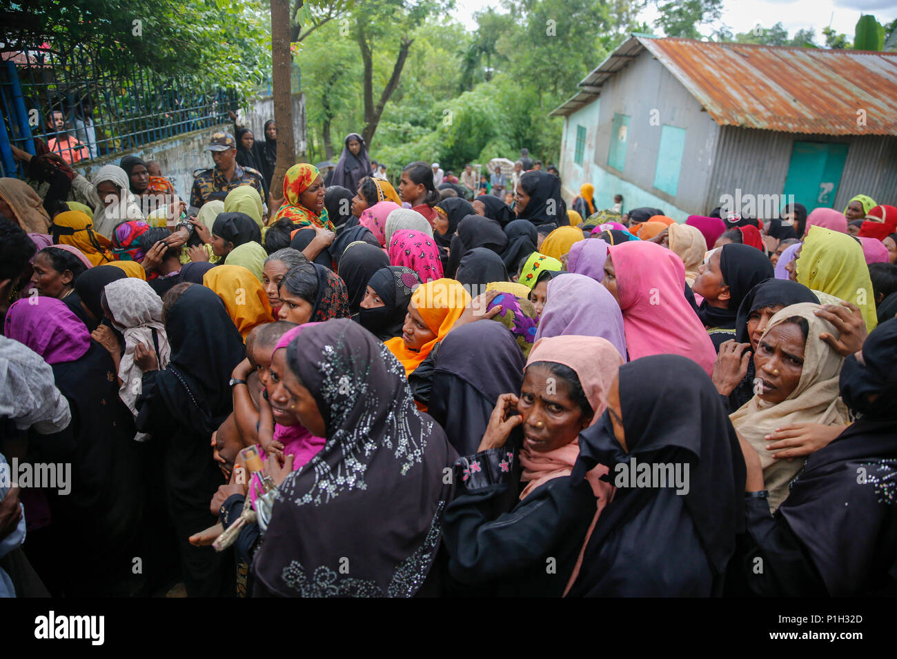 Rohingya refugees wait for biometric registration at the Kutupalong refugee camp at Ukhia in Cox's Bazar, Bangladesh Stock Photo
