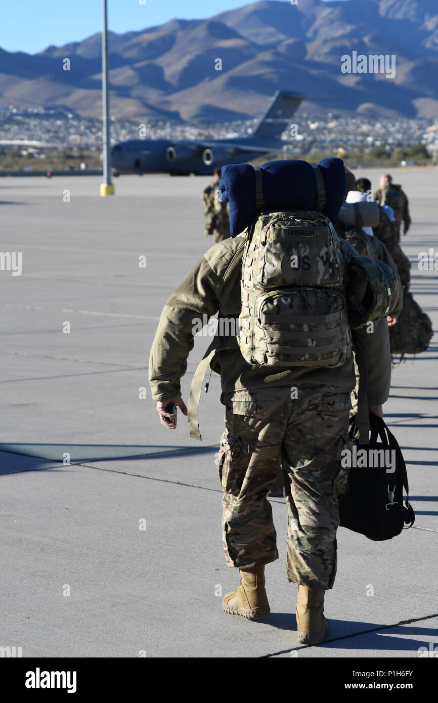 Soldiers with 215th Military Police Detachment and the 467th Engineer Detachment Firefighting Headquarters, Army Reserve units, board a flight at the Silas L. Copeland Arrival/Departure Airfield Control Group here Nov. 30 for a deployment in support of Operation Freedom’s Sentinel. Stock Photo