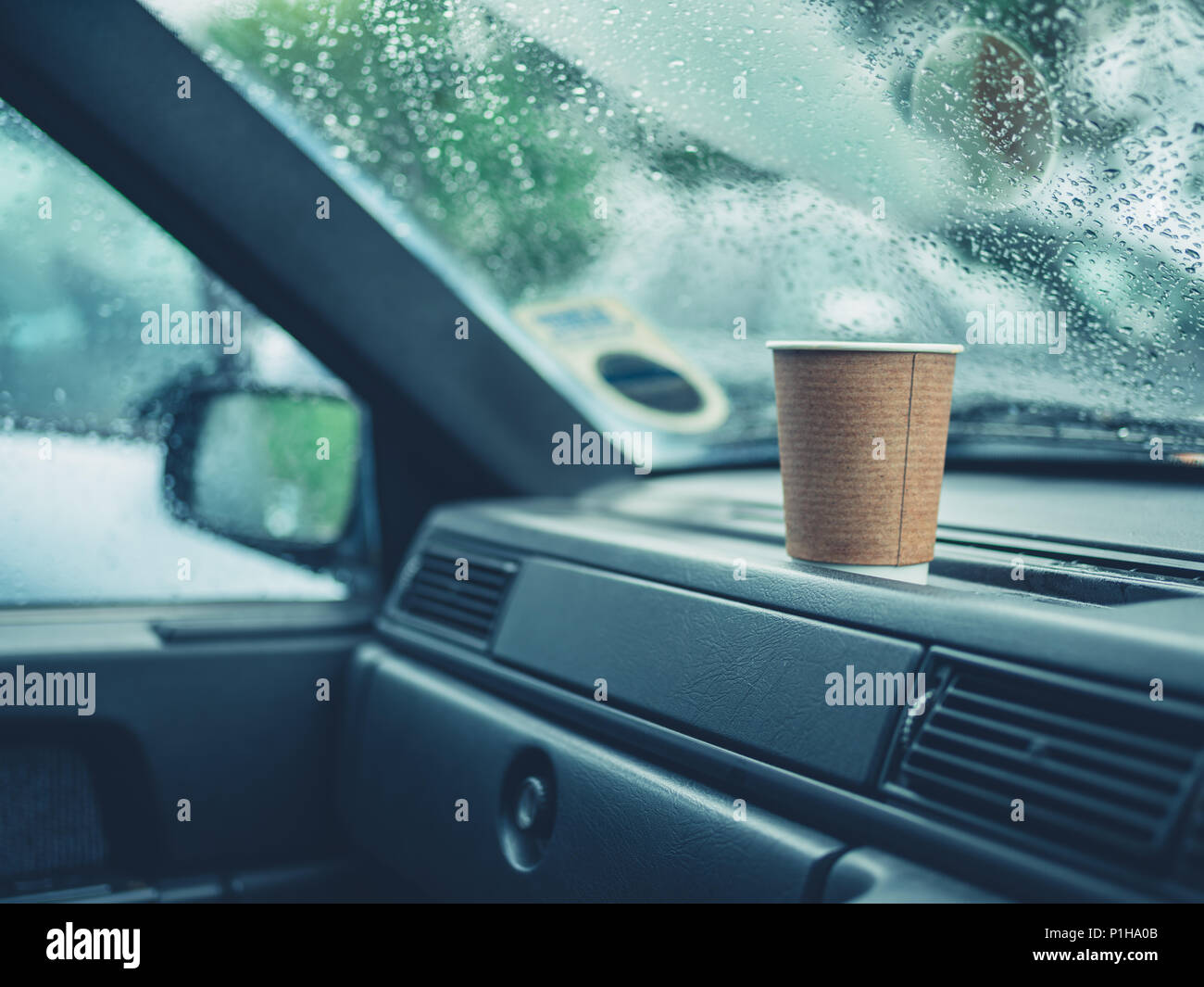 A Paper Cup Of Coffee On A Dashboard On A Rainy Day Stock Photo Alamy A Paper Cup Of Coffee On A Dashboard On A Rainy Day Stock Photo Alamy