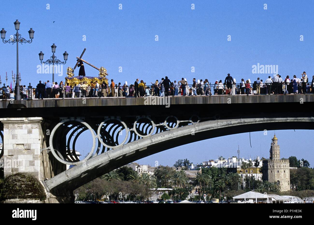 Semana santa sevilla puente de triana hi-res stock photography and ...