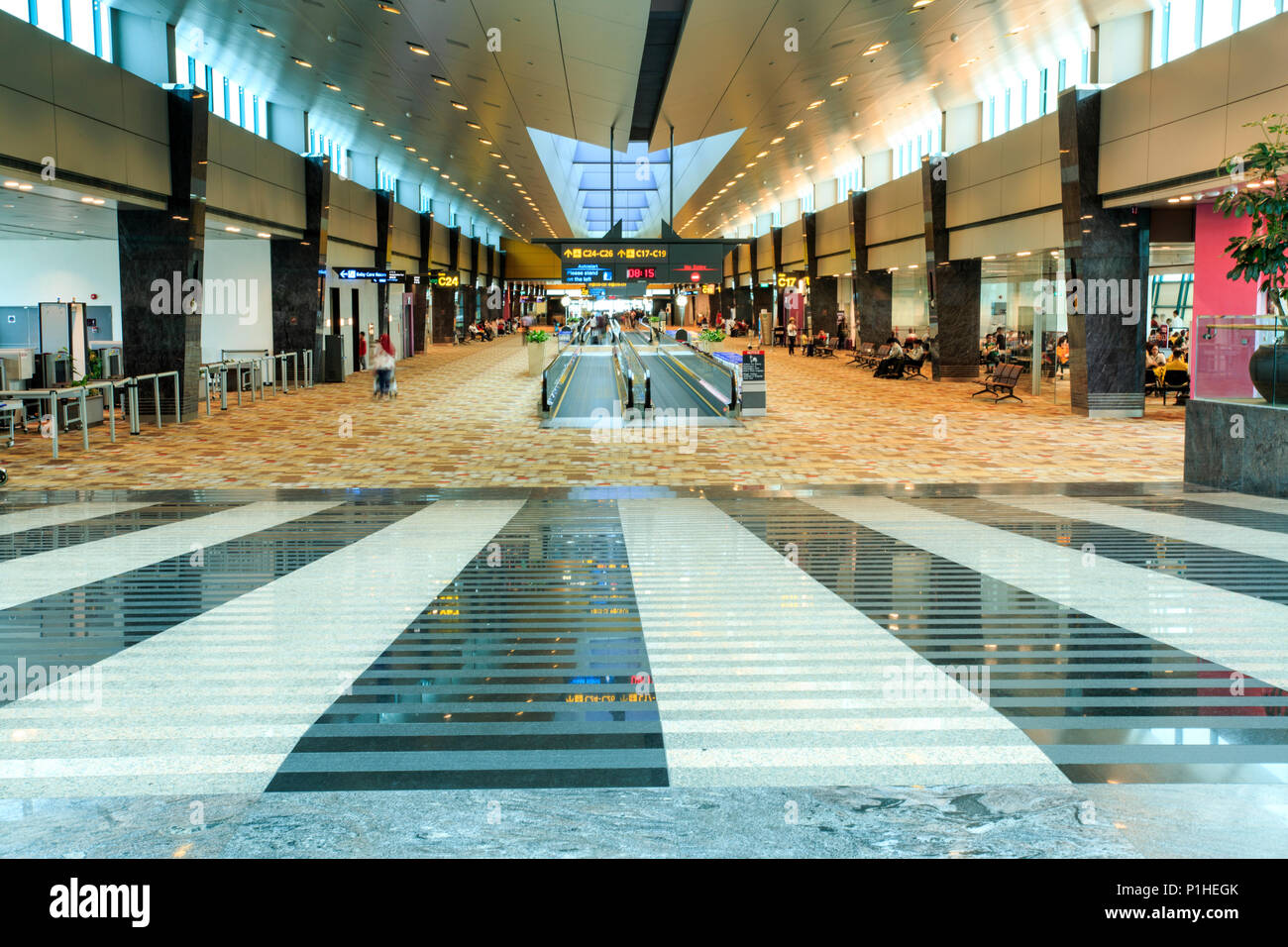 View of the very long hallways and travelators of Changi Airport in Singapore, South East Asia Stock Photo