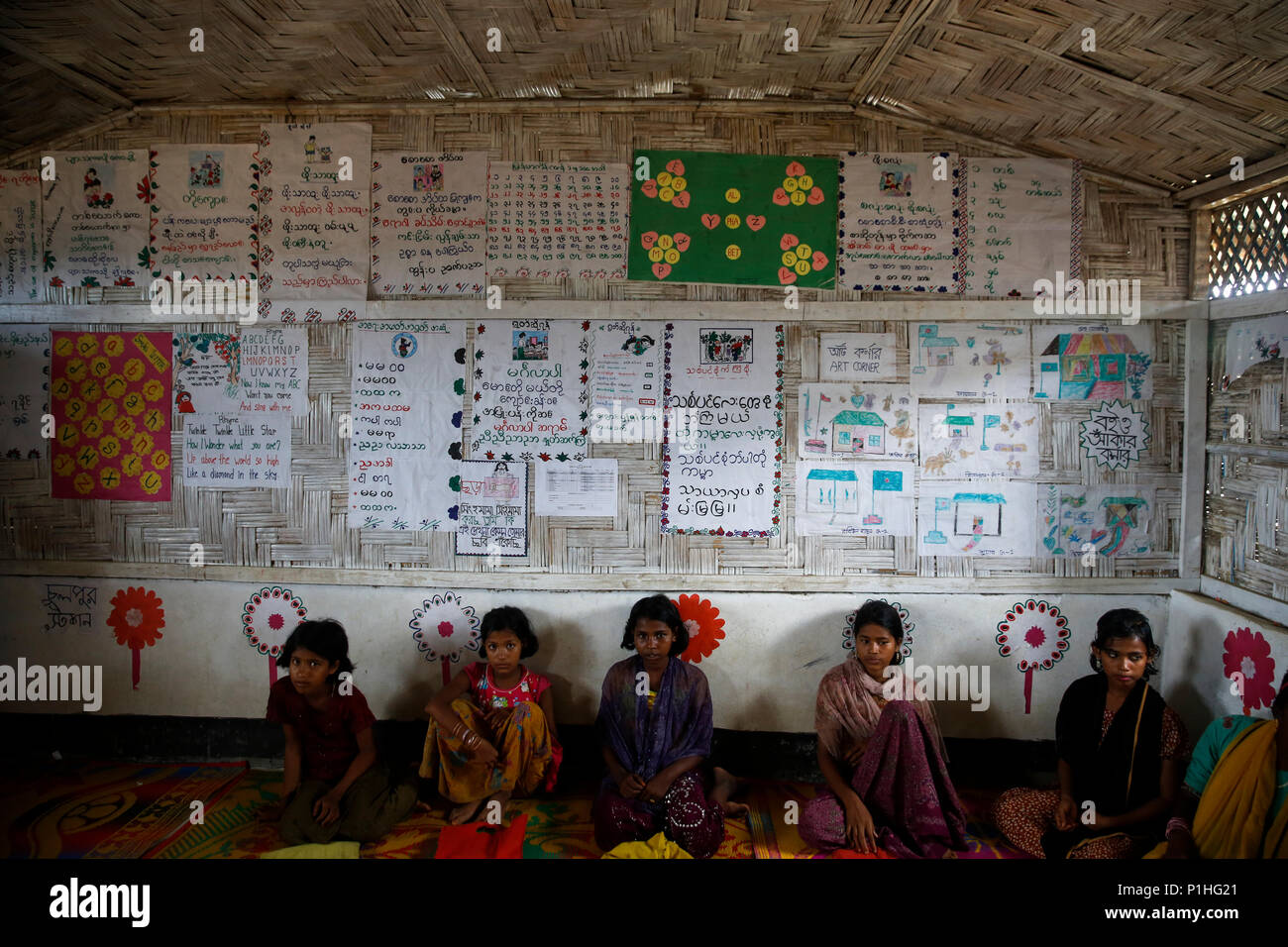 Rohingya refugee children attend class at a temporary school in ...