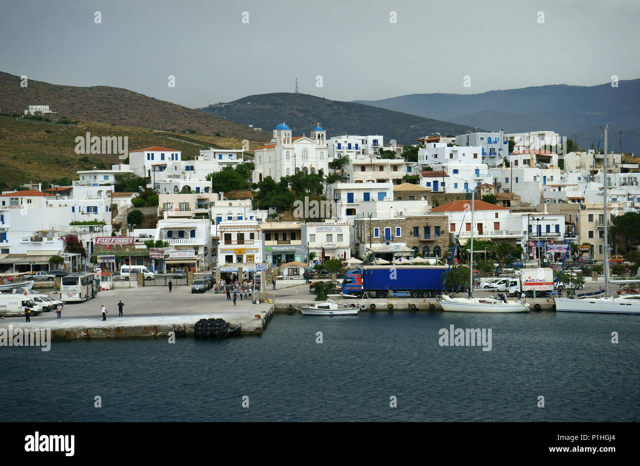 Town Gavrio seen from ferry, Island Andros, Cyclades islands, Greece Stock Photo