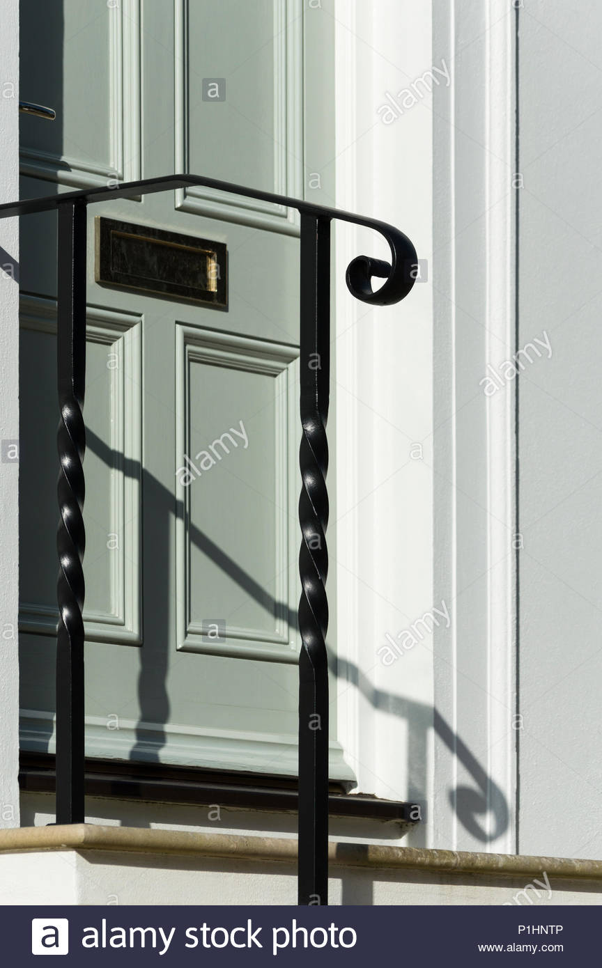 Looking at a house letter box through the handrail to the front door ... Looking at a house letter box through the handrail to the front door ...