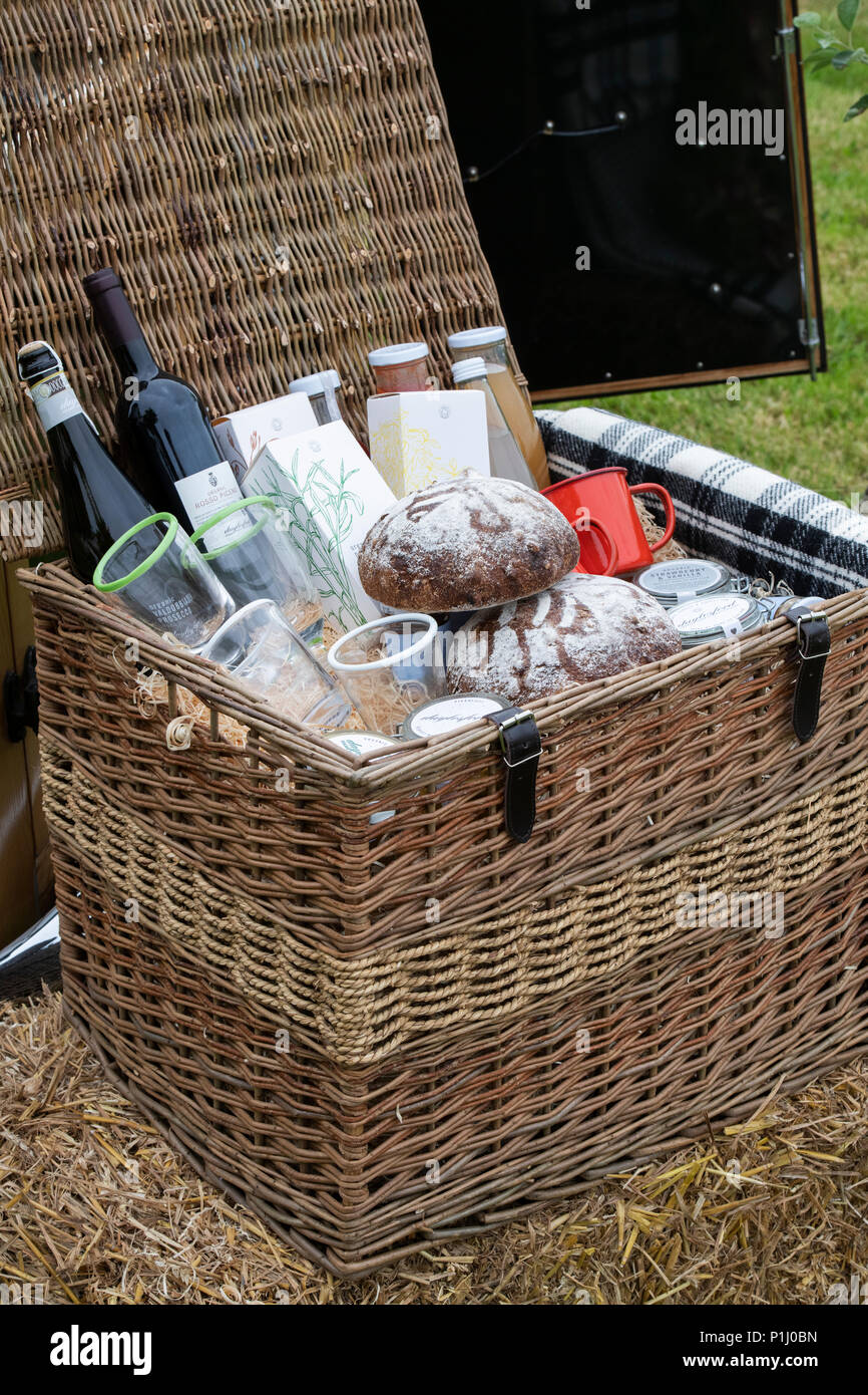 Picnic hamper display at Daylesford Organic farm summer festival. Daylesford, Cotswolds, Gloucestershire, England Stock Photo