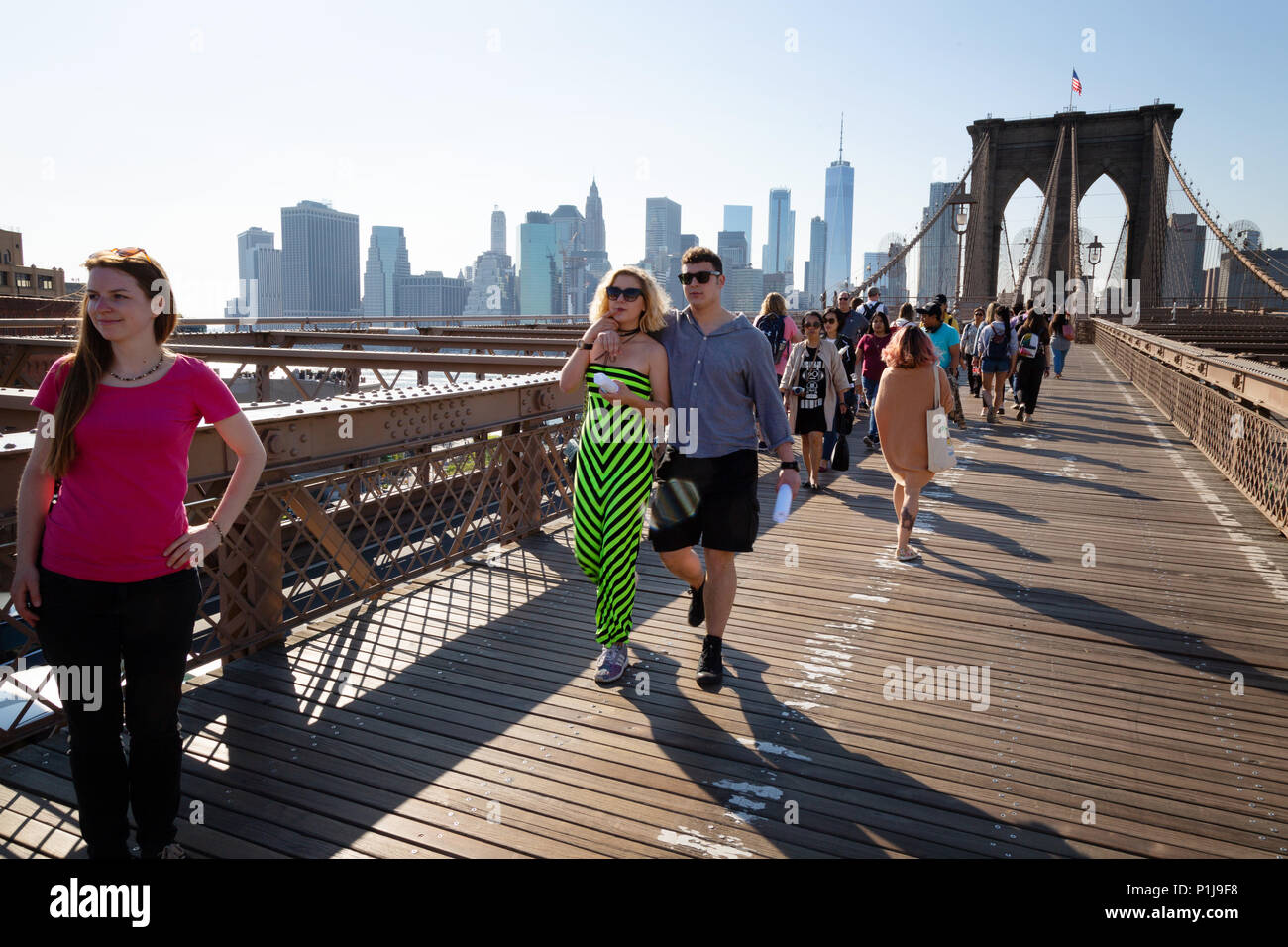 People walking across the Brooklyn Bridge, Brooklyn, Manhattan, New York city, USA Stock Photo