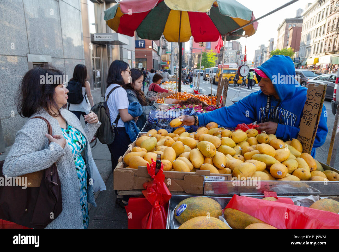 Chinatown New York city - people shopping at roadside stalls, Chinatown street market, Chinatown, New York USA Stock Photo