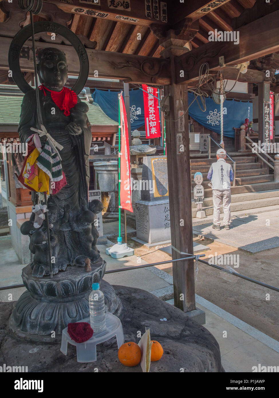 Buddhist bronze statue , with children, , henro pilgrim praying
