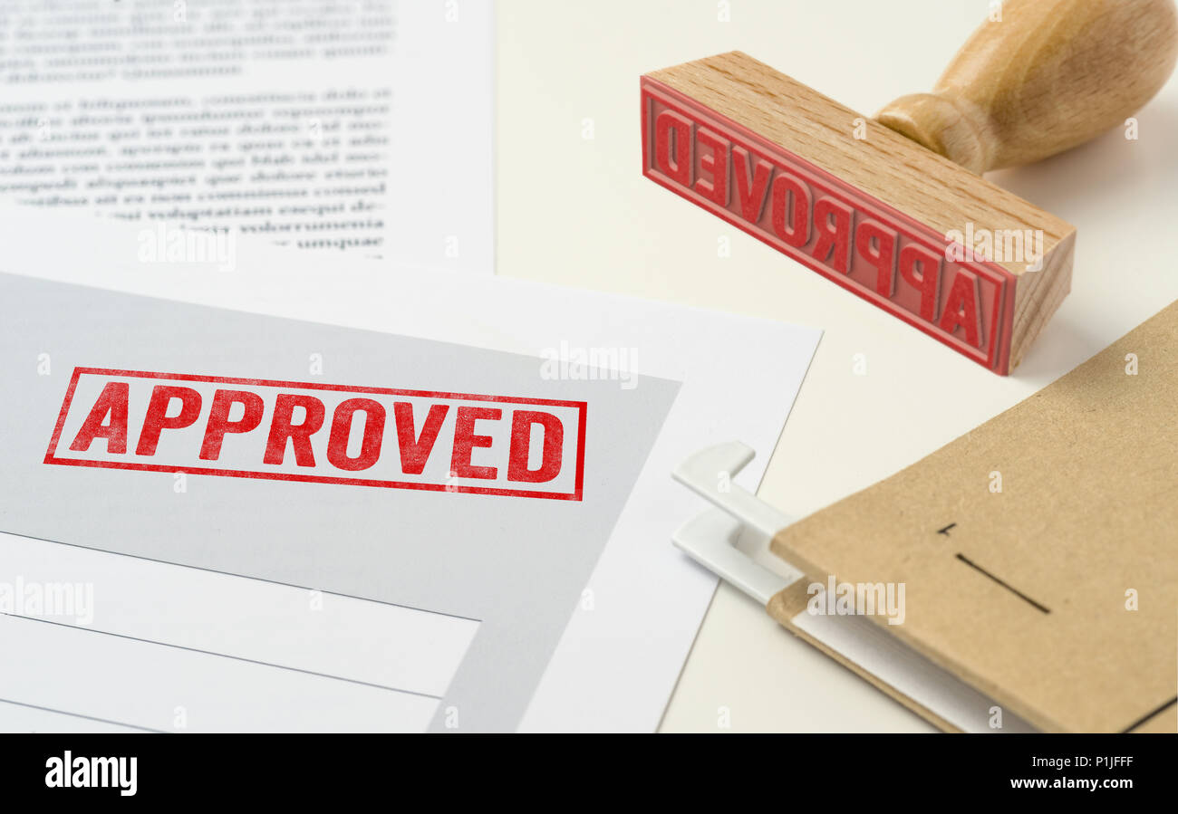A red stamp on a document Approved Stock Photo Alamy