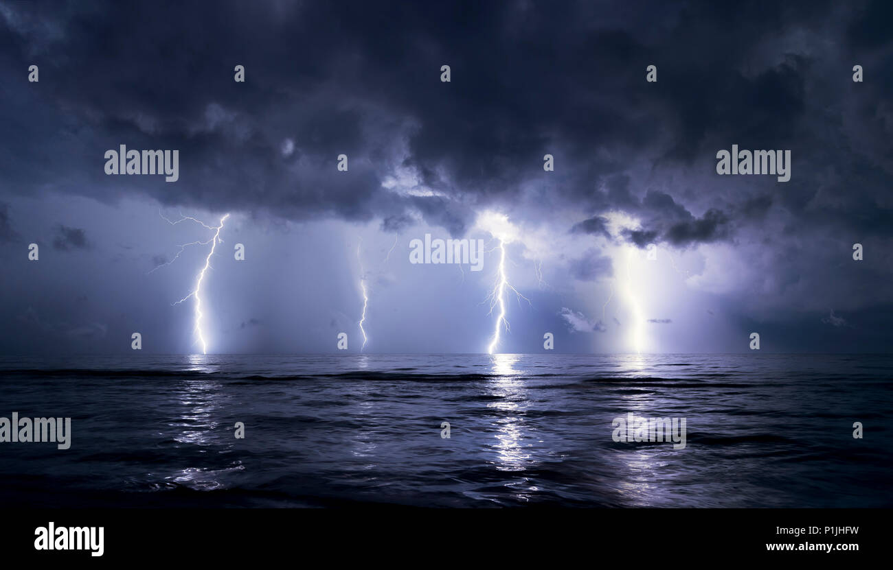 Bright cloud-ground lightning with reflection on the surface of lake Maracaibo (Catatumbo thunderstorm, the place with the highest lightning density worldwide), Ologa, Zulia, Venezuela, South America Stock Photo