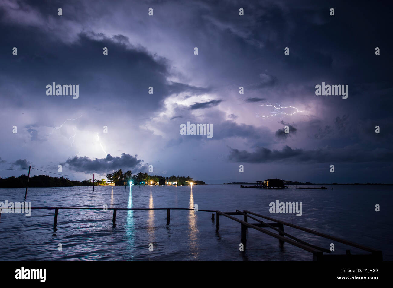 Cloud-to-ground and crawler lightning discharges above a village of fishermen (Catatumbo thunderstorm, the place with the highest lightning density worldwide), Ologa, Zulia, Venezuela, South America Stock Photo