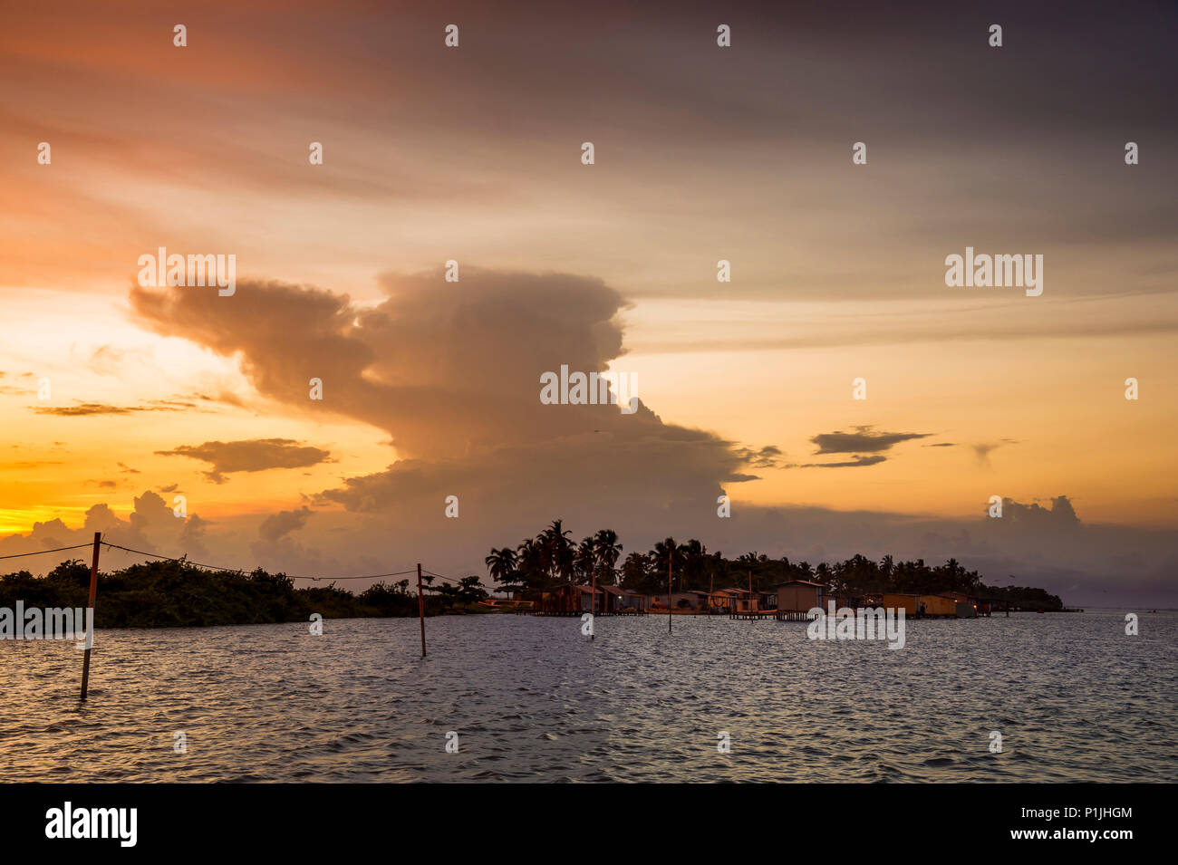 Blown away anvil of a thunderstorm during sunrise above a fishermen village (Catatumbo thunderstorm, the place with the highest lightning density worldwide), Ologa, Zulia, Venezuela, South America Stock Photo