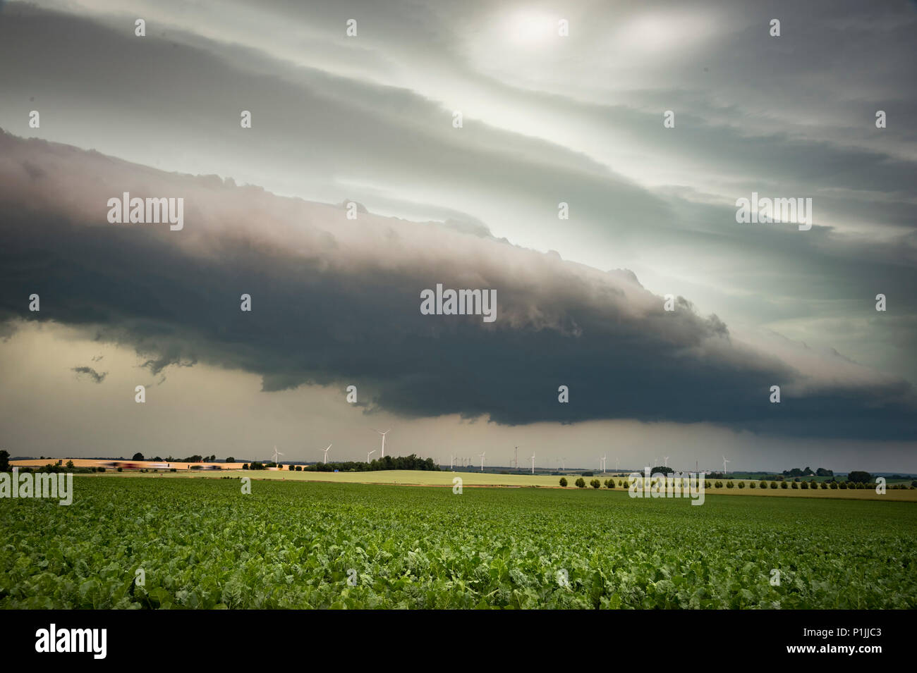 Powerful shelf cloud with an approaching mesoscale convective system (MCS) near Döbeln, Saxony, Germany Stock Photo
