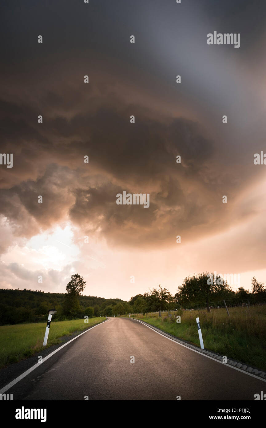 Base of a dynamic mesocyclone of a LP supercell during sunset, near Herborn, Hessia, Germany Stock Photo