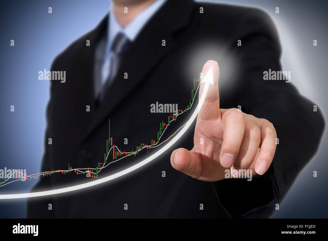Businessman Touching a Graph Indicating Growth. Stock Photo