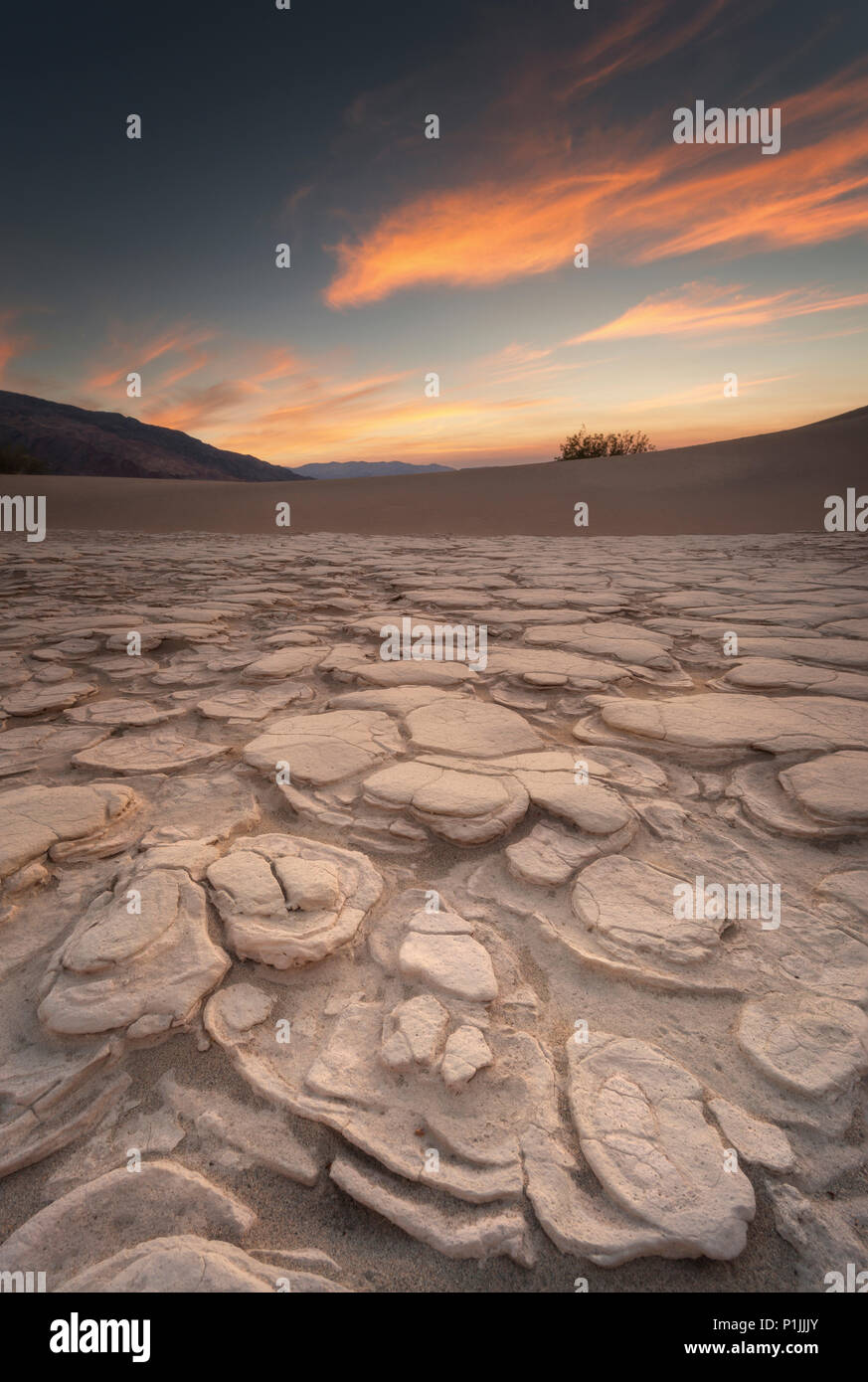 Dry clay between the dunes in Death Valley Nationalpark, California, USA Stock Photo